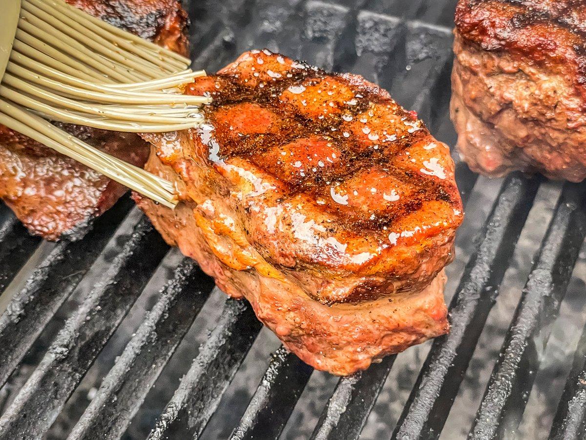 Brush on melted butter seasoned with additional rub before serving.