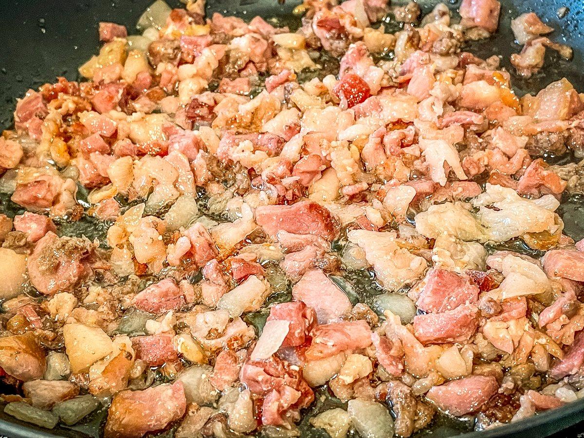 Cook the diced bacon till crisp.