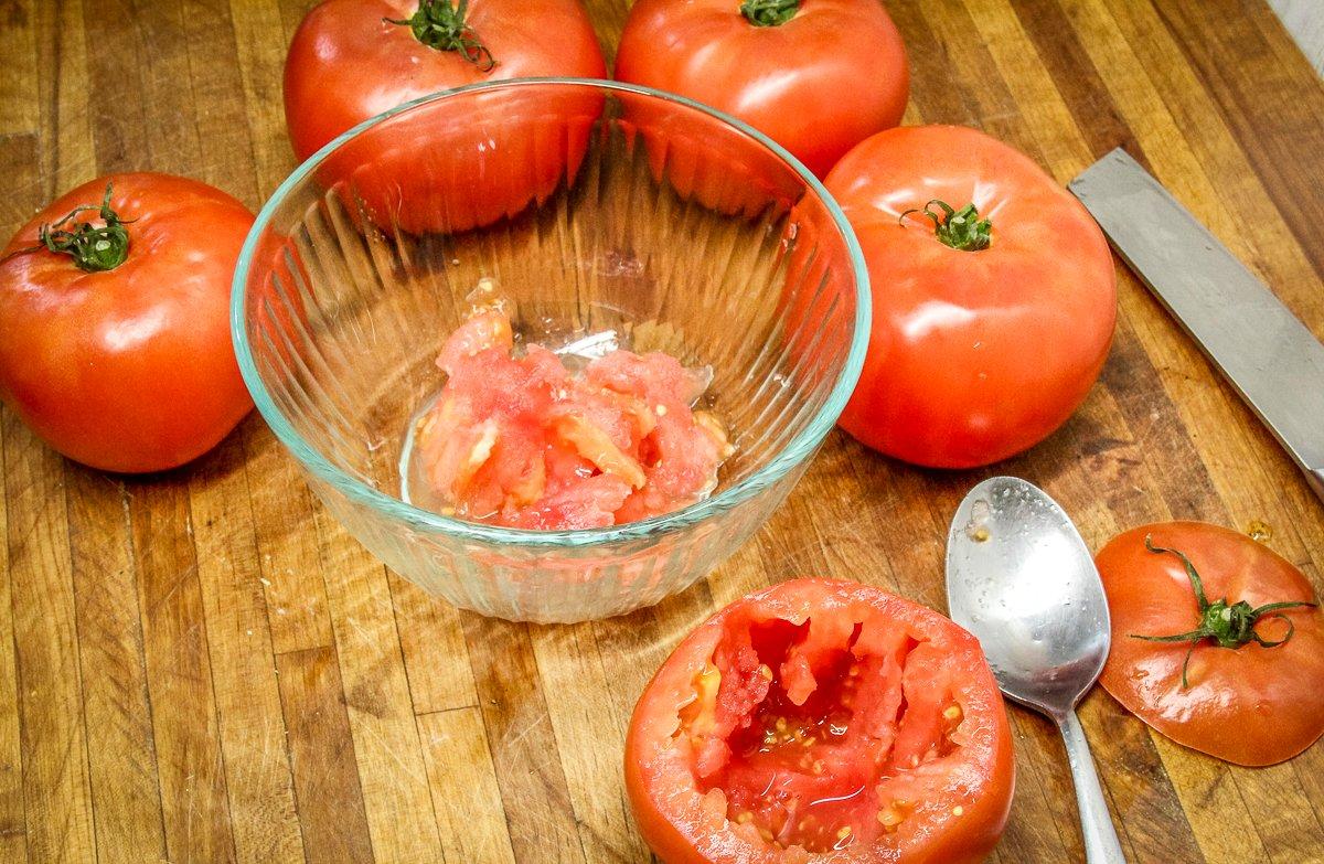 Hollow out the tomatoes with a spoon and reserve the pulp.