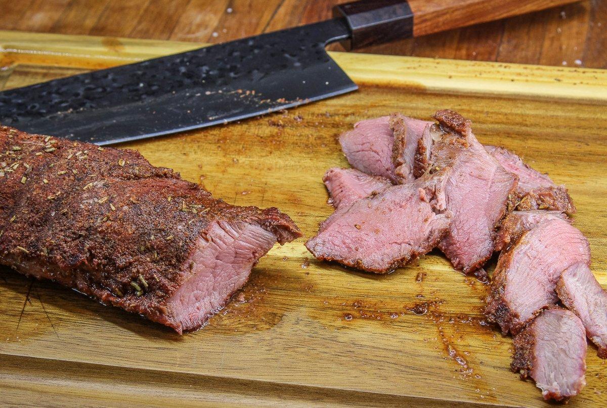 Rest the grilled venison before slicing thinly across the grain.