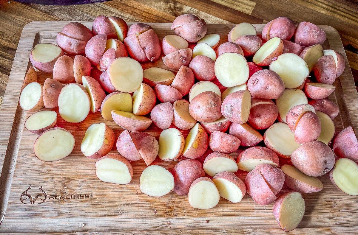 Halve or quarter the red potatoes.