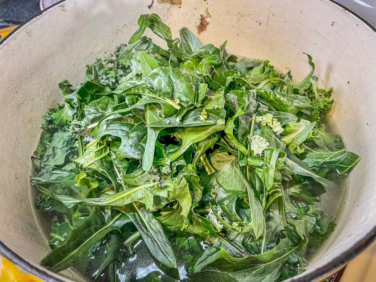 Add the mixed greens to the pot.