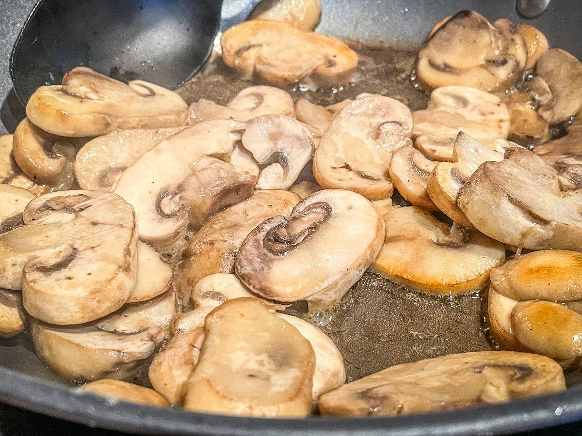 Sauté the mushrooms before adding them to the omelet.