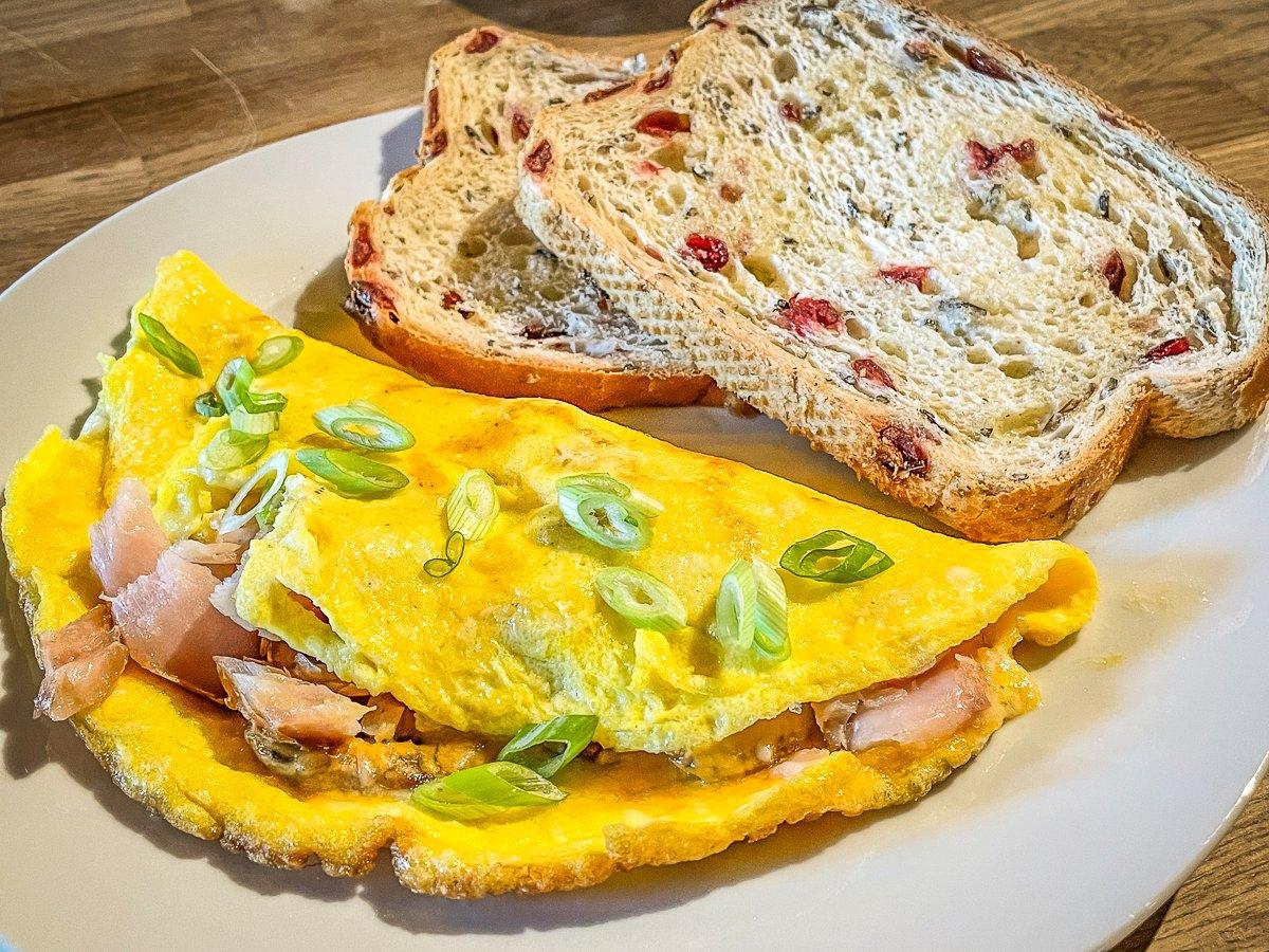 We love to serve the omelets with toast from local bread made with wild rice and cranberries.