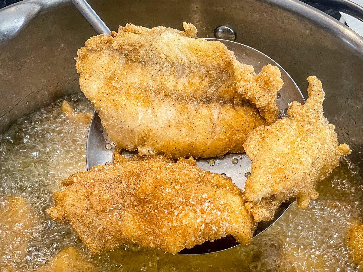 Fry until the fillets float and turn golden brown and crispy.