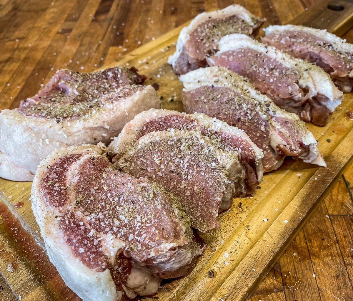 Season the chops well on both sides before grilling.