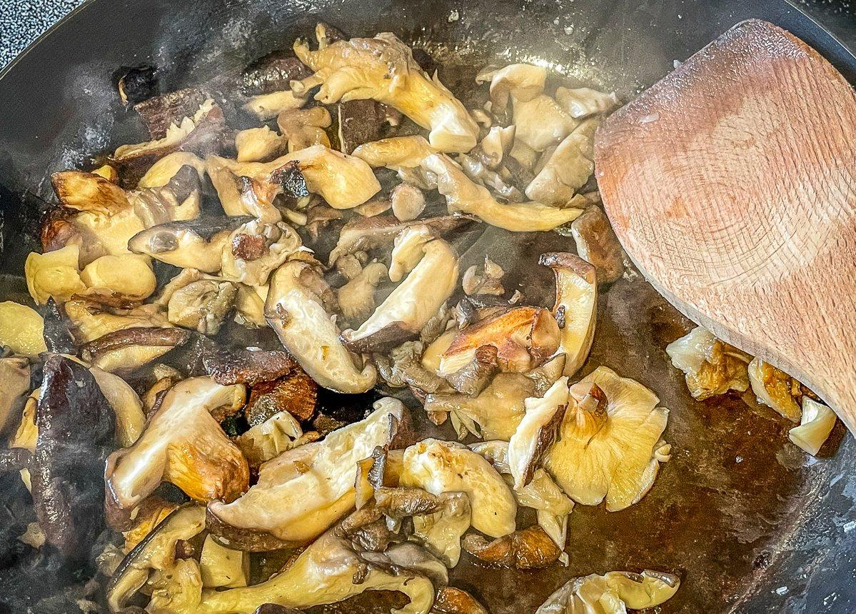 Brown the mushrooms in butter.