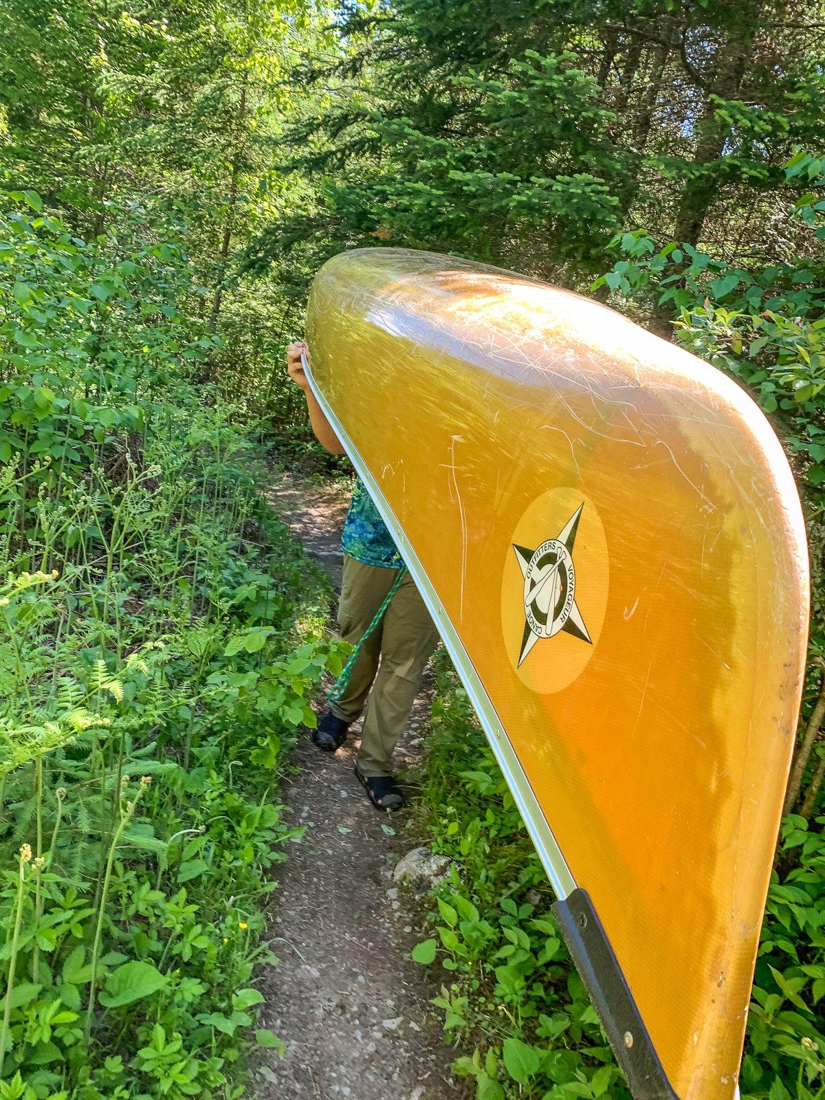 Portaging your canoe and gear is the best way to reach more remote lakes. Image by Michael Pendley