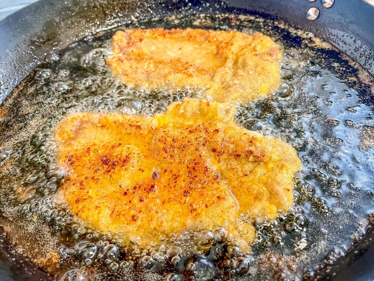 Fry the tenderloin until the breading is crisp and golden and the venison is medium-rare.