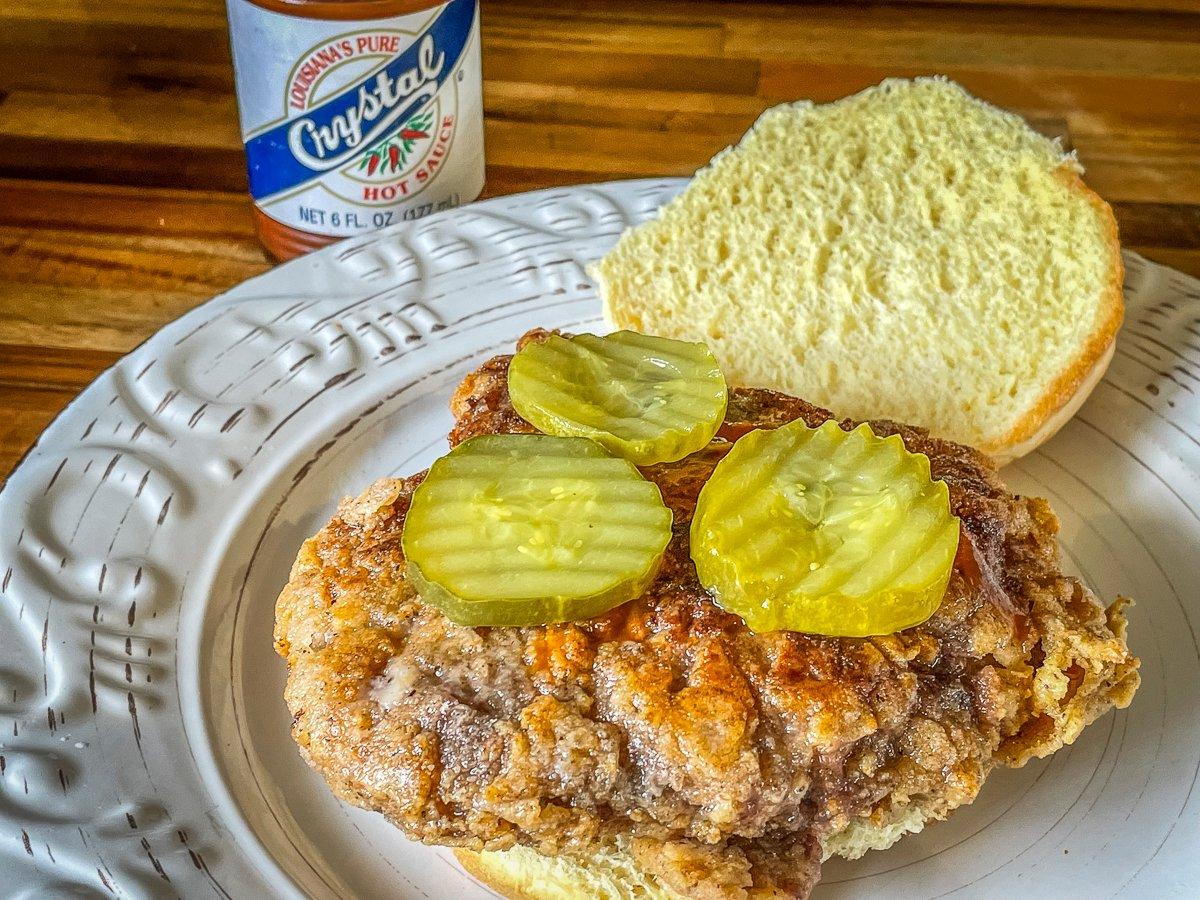 Top with pickles and hot sauce, if desired.