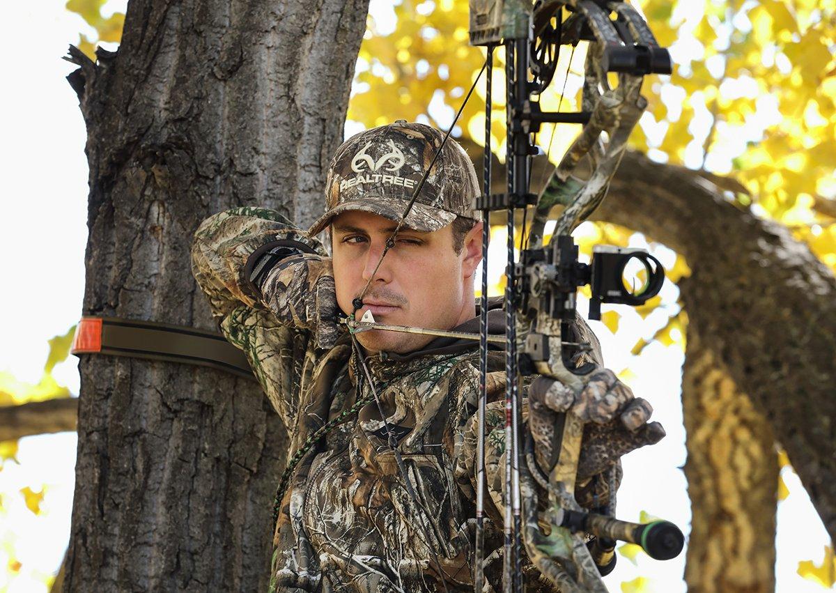 You can count on your accuracy to suffer when bundled up in hunting clothes and in a precarious treestand position. Image by Realtree