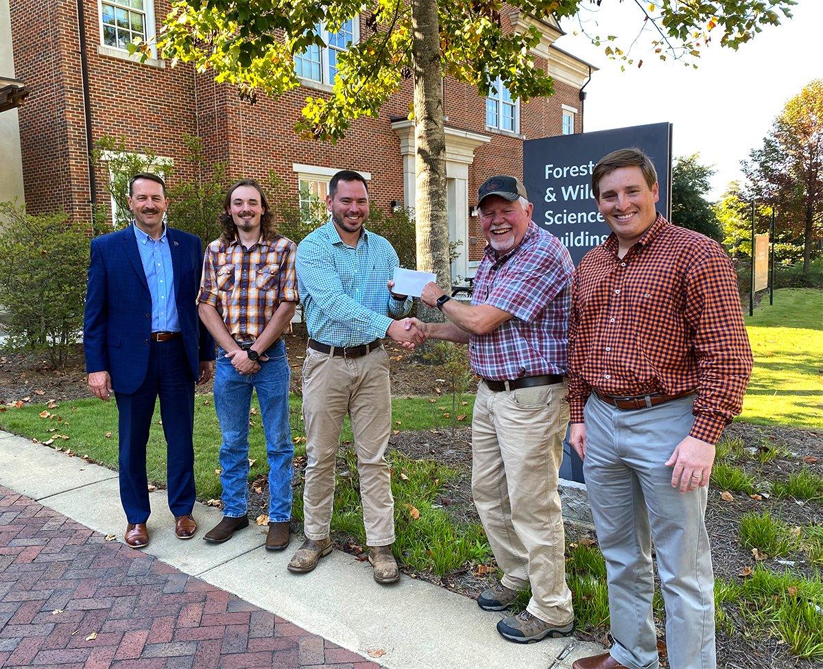Auburn wildlife research leader Will Gulsby accepts a check from Ron Jolly, TFT co-chairman of the board. Also, left to right, Tim Gothard, Alabama Wildlife Federation executive director; Matthew Day, researcher; and Carter Weeks, TFT legal counsel. Image by Turkeys for Tomorrow