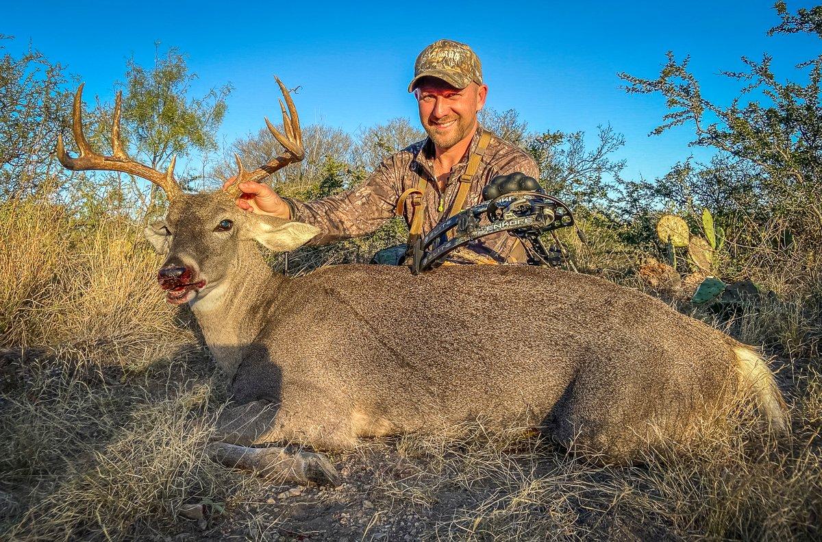 The author with a Texas buck he killed with an Elite EnKore. Shooting 60 pounds with a heavy arrow, he got a length-ways pass-through on a sharply quartering shot. Image by Yamaha 
