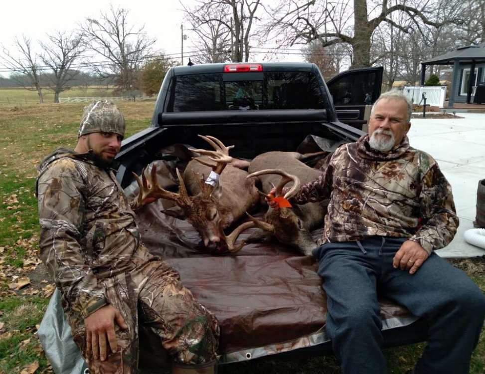 Levi and Larry Watkins show off their opening day Indiana bucks. 