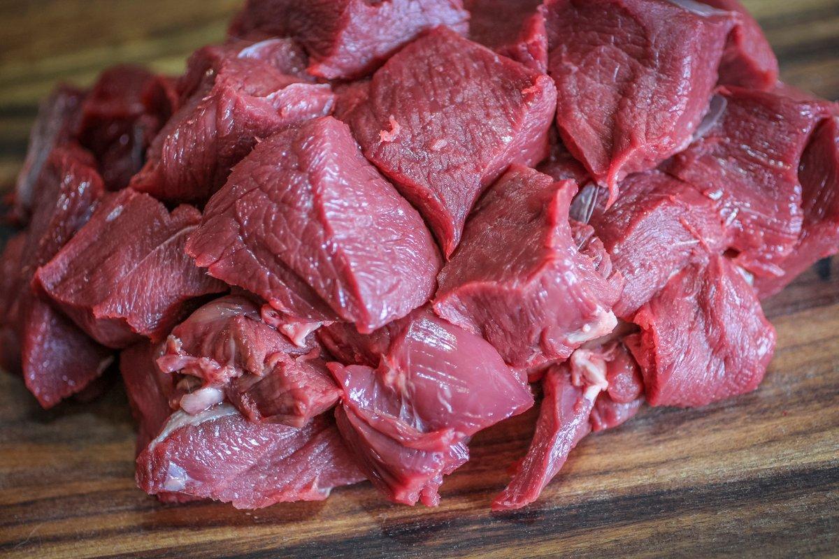 Trim the venison well and cut it into approximately one-inch cubes.