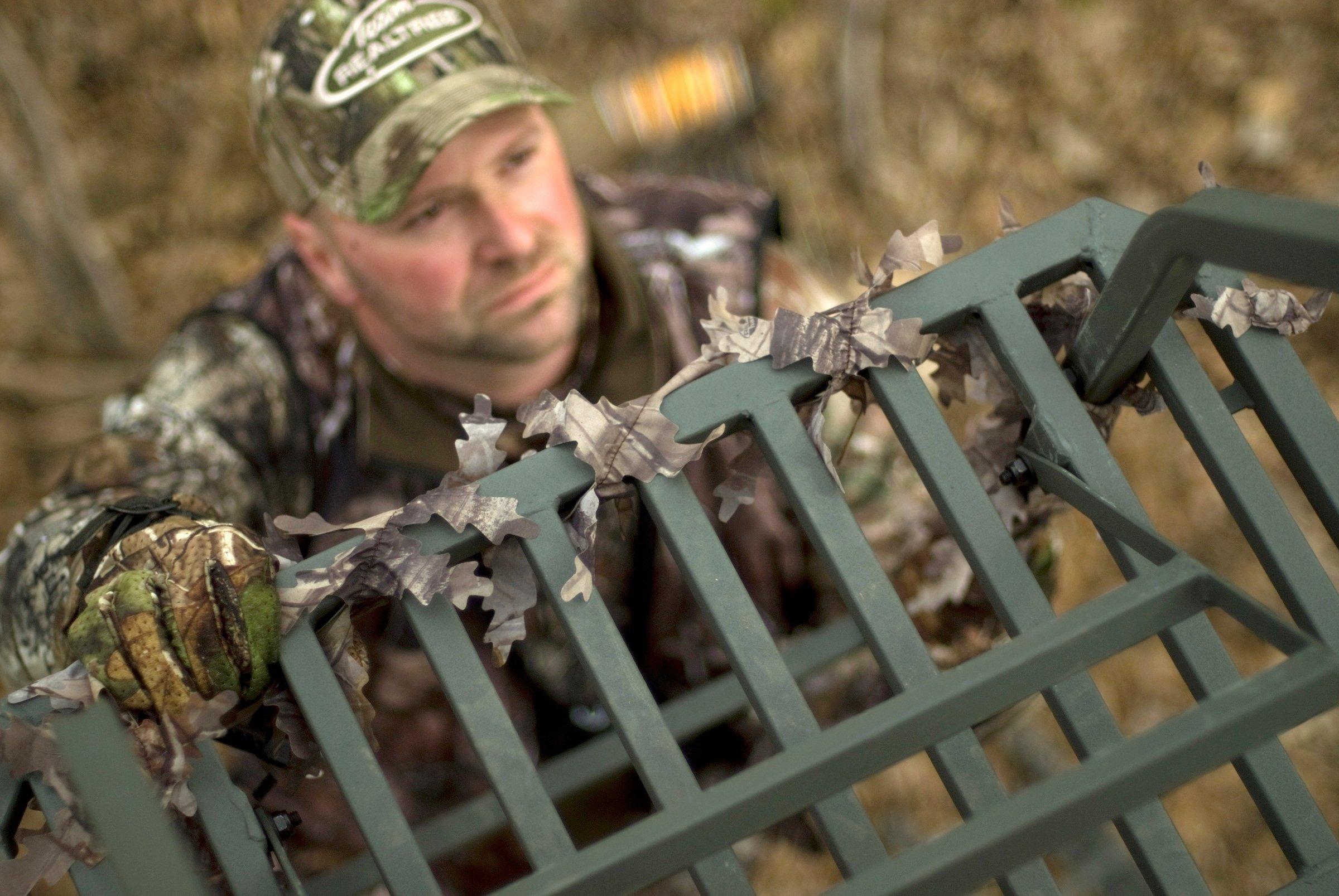 Hunter climbing into a stand