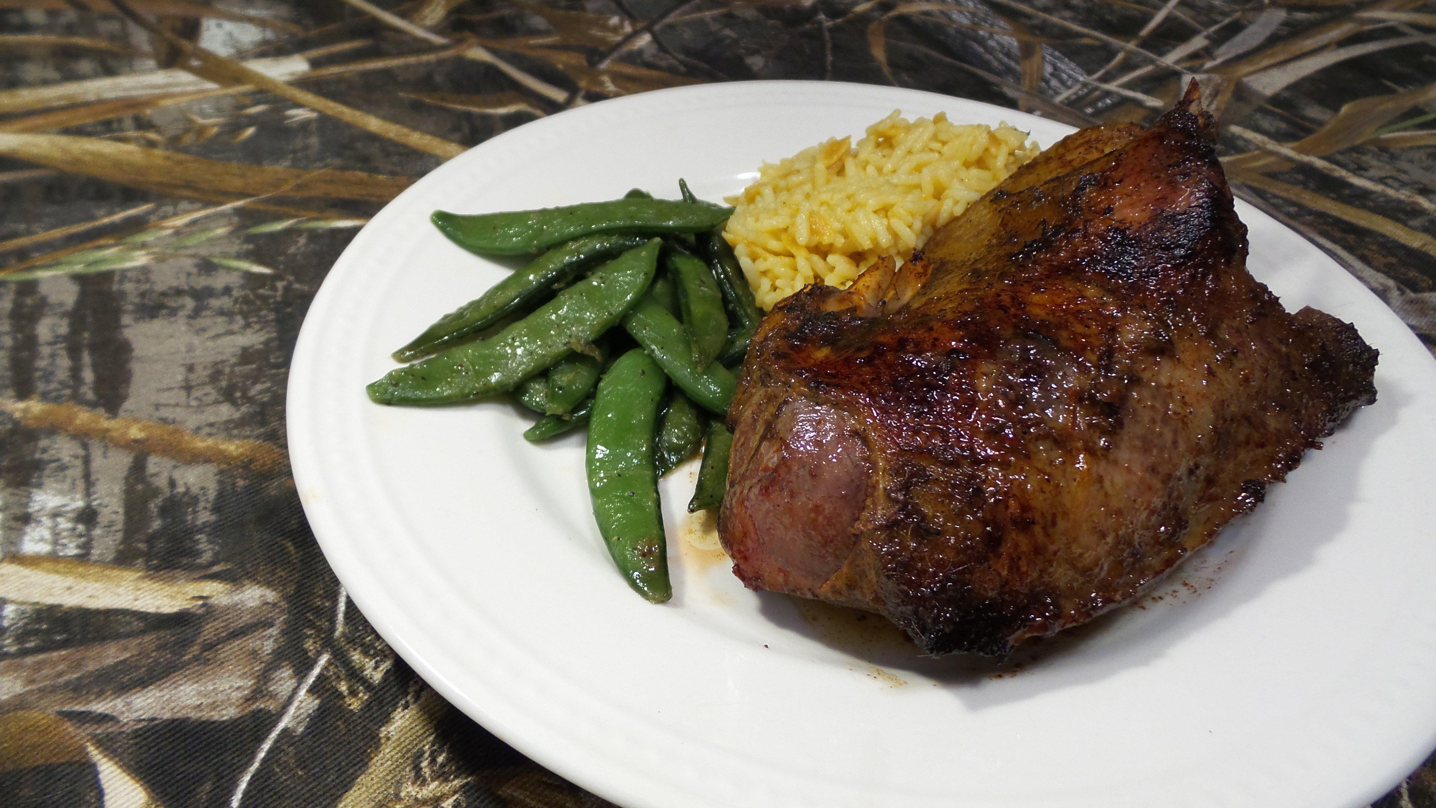 The Asian inspired marinade of Kentuckyaki Duck pairs well with snow peas and rice pilaf.