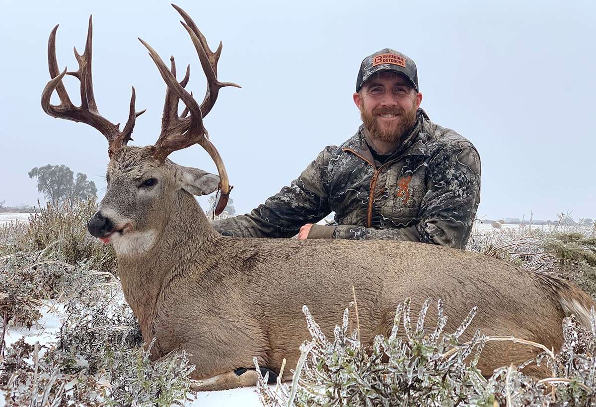 Kyle Barefield was all smiles after recovering his huge Oklahoma whitetail. Image by All Things Hunting
