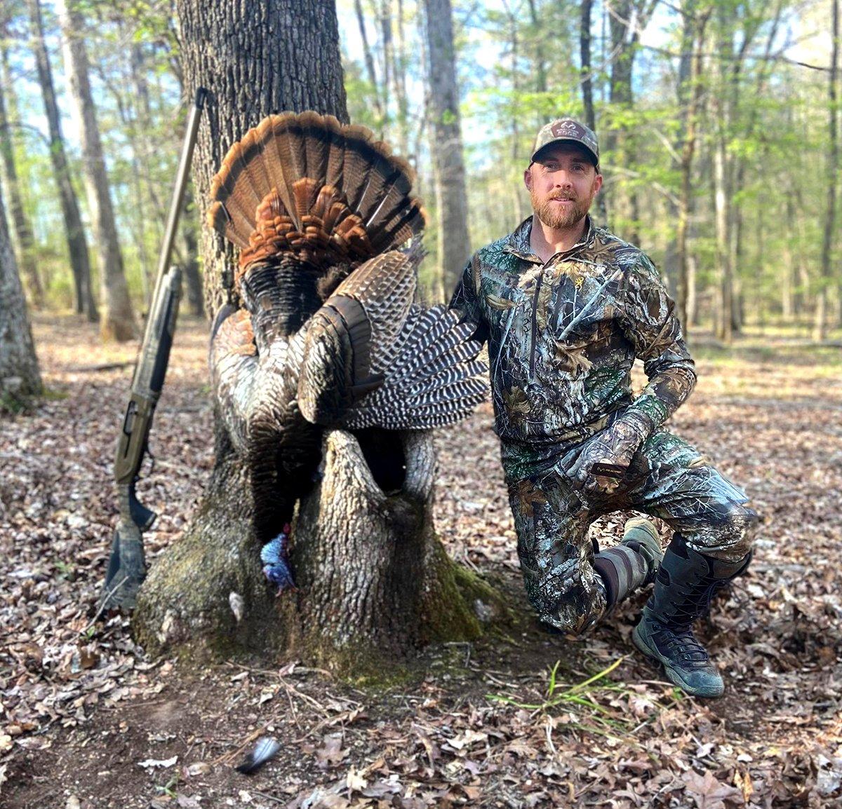 All Things Hunting's Kyle Barefield poses with his Louisiana longbeard. Image by All Things Hunting