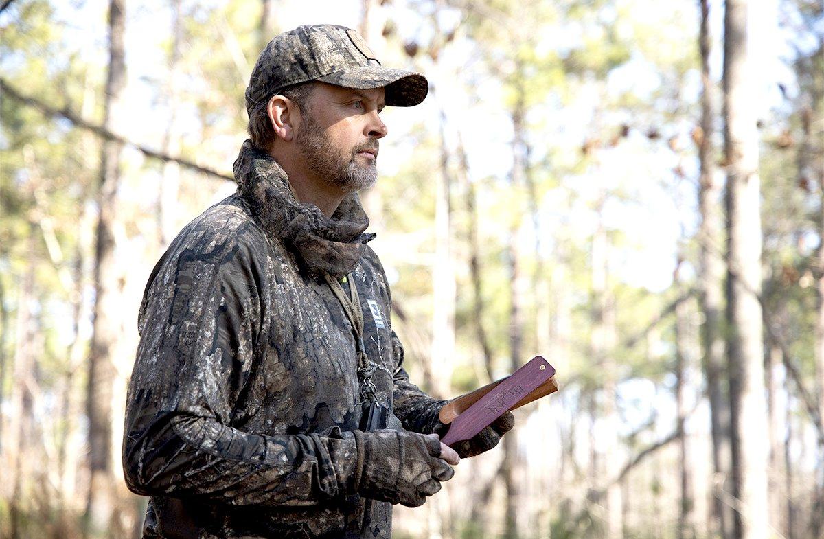 Michael Waddell reaches out to touch a long-distance gobbler. Image by Bone Collector