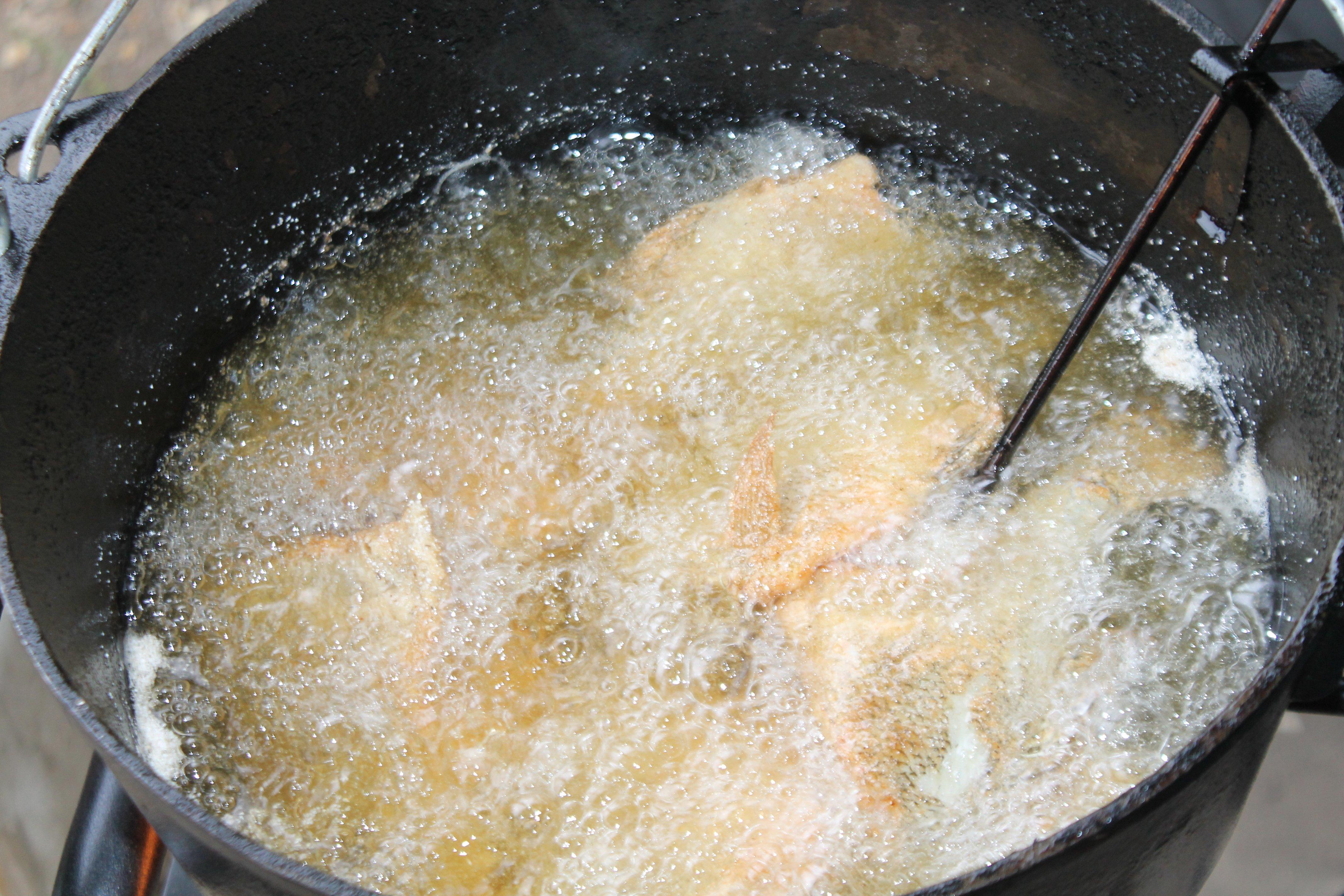 Maintaining a 325-350 degree temperature allows the fish to cook through without overcooking the crust.