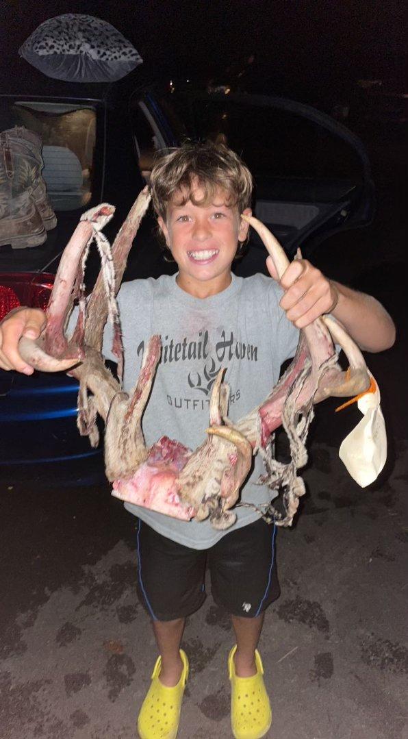 Westin (left) and Micah (right) were thrilled to celebrate the taking of Noah's (middle) first buck ever, this triple-beamed bruiser. Image courtesy of Tevis McCauley/Whitetail Heaven Outfitters