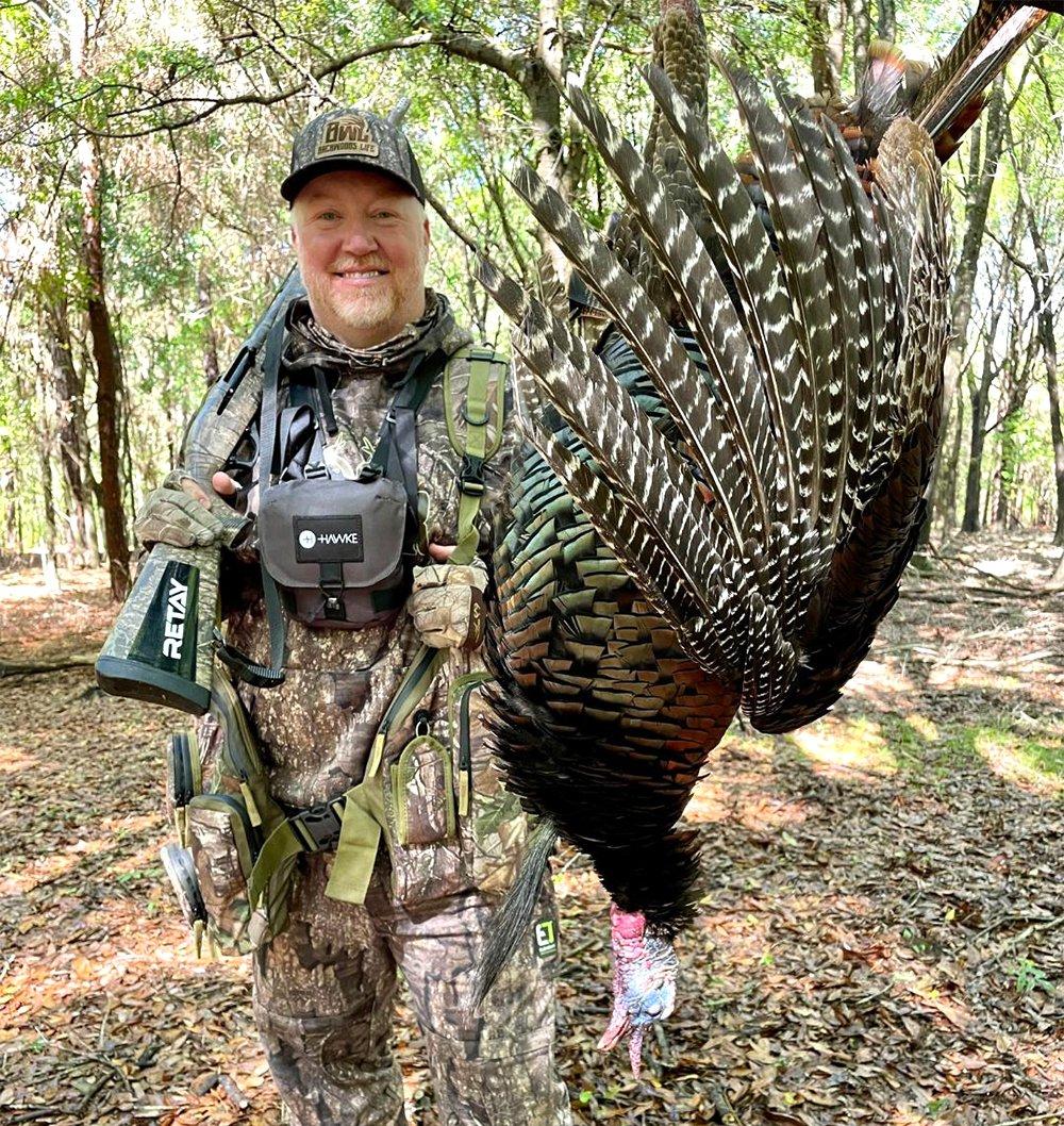 Backwoods Life's Michael Lee poses with one of his two 2022 Florida turkeys. Image by Backwoods Life