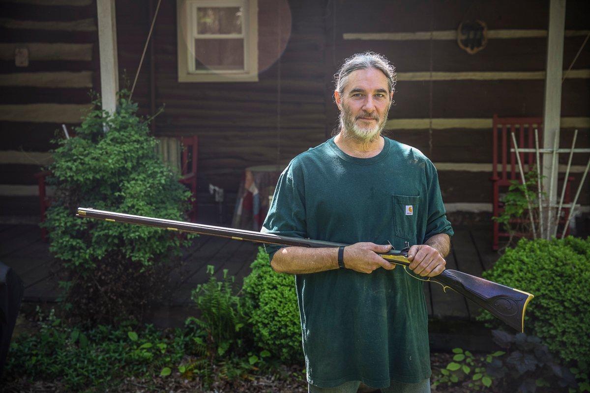 Mike Miller with a finished flintlock. Image courtesy of Mike Miller