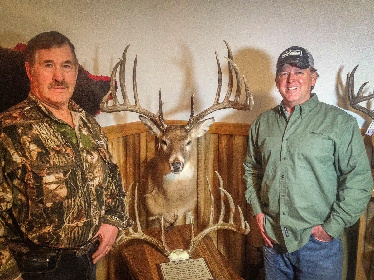 Milo Hanson (left) and the author with the world-record whitetail. 