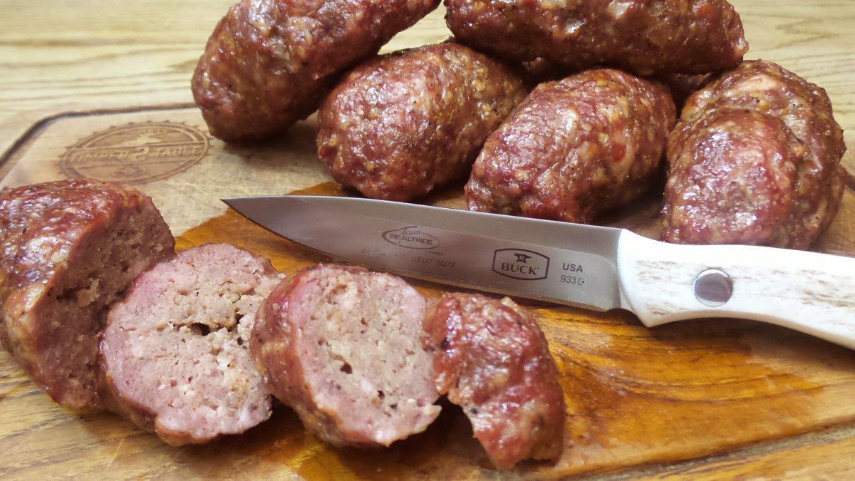 The sausage texture is dense, more closely resembling a bratwurst than a burger.