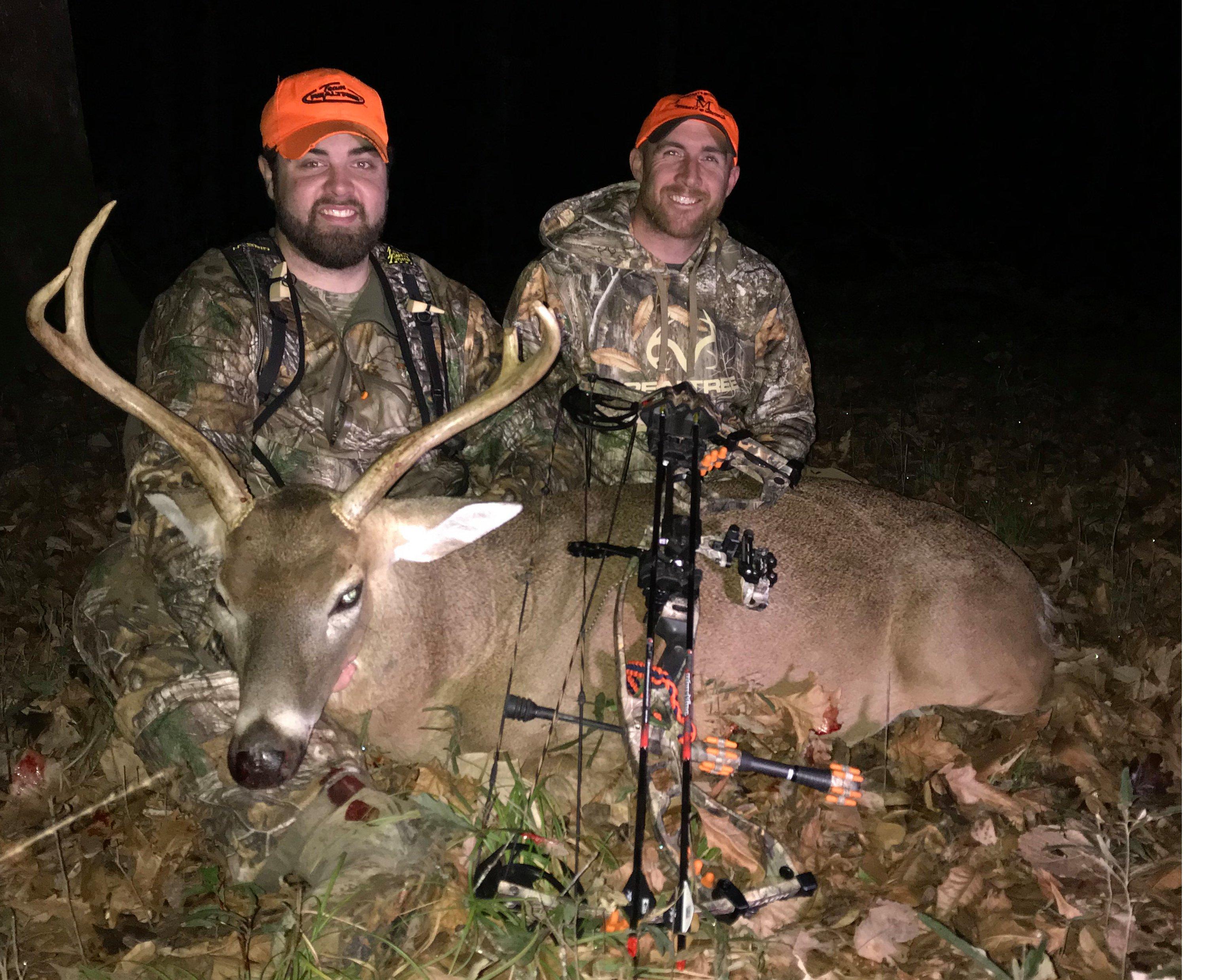 Garret Deavers, a senior with the President's Outdoor Scholars Program, and Kyle Barefield, program sponsor and host of All Things Hunting, show off a deer taken by Deavers. -- Image provided by President's Outdoor Scholars Program