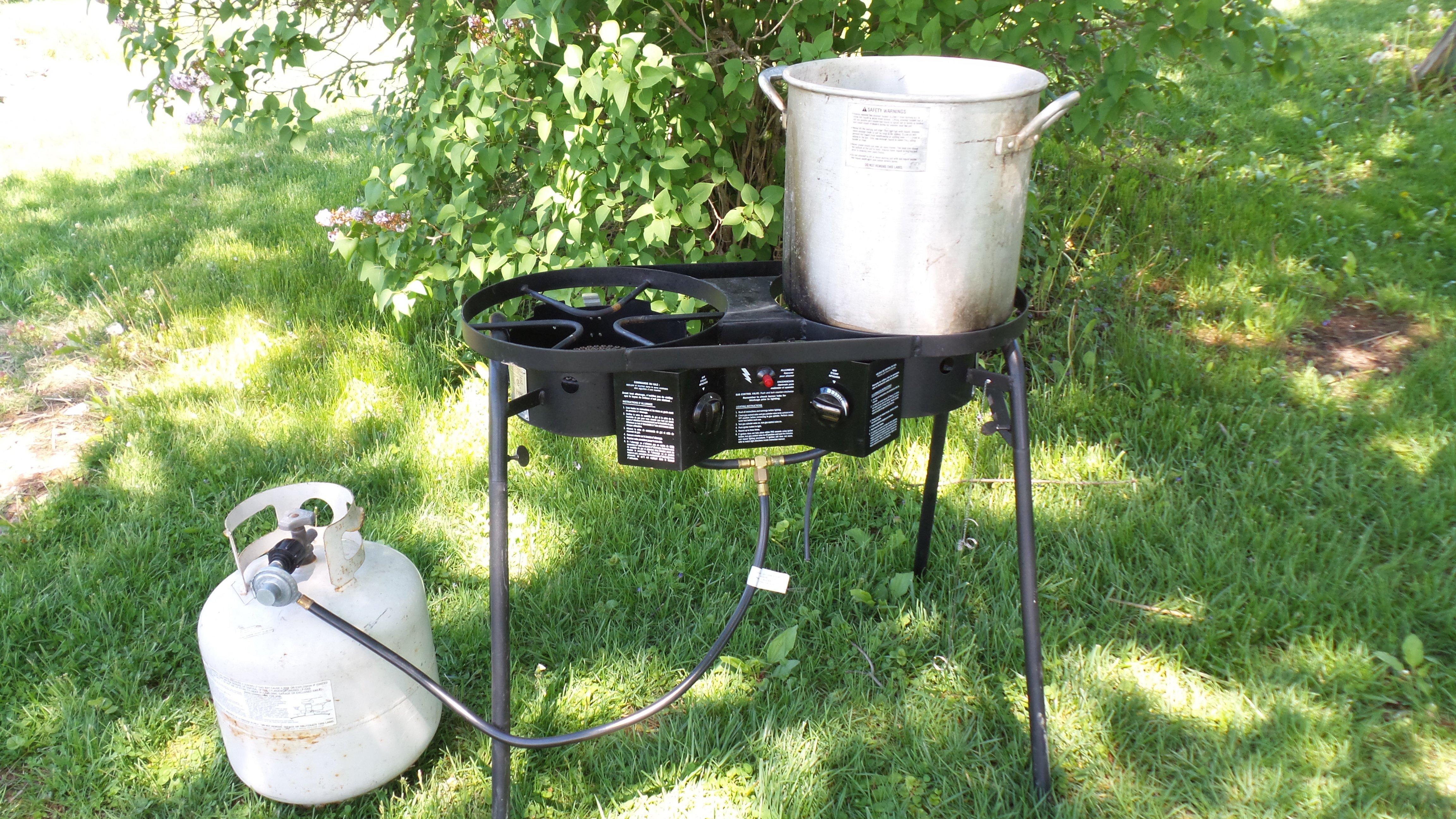 An outdoor burner and large pot are perfect for scalding a turkey.