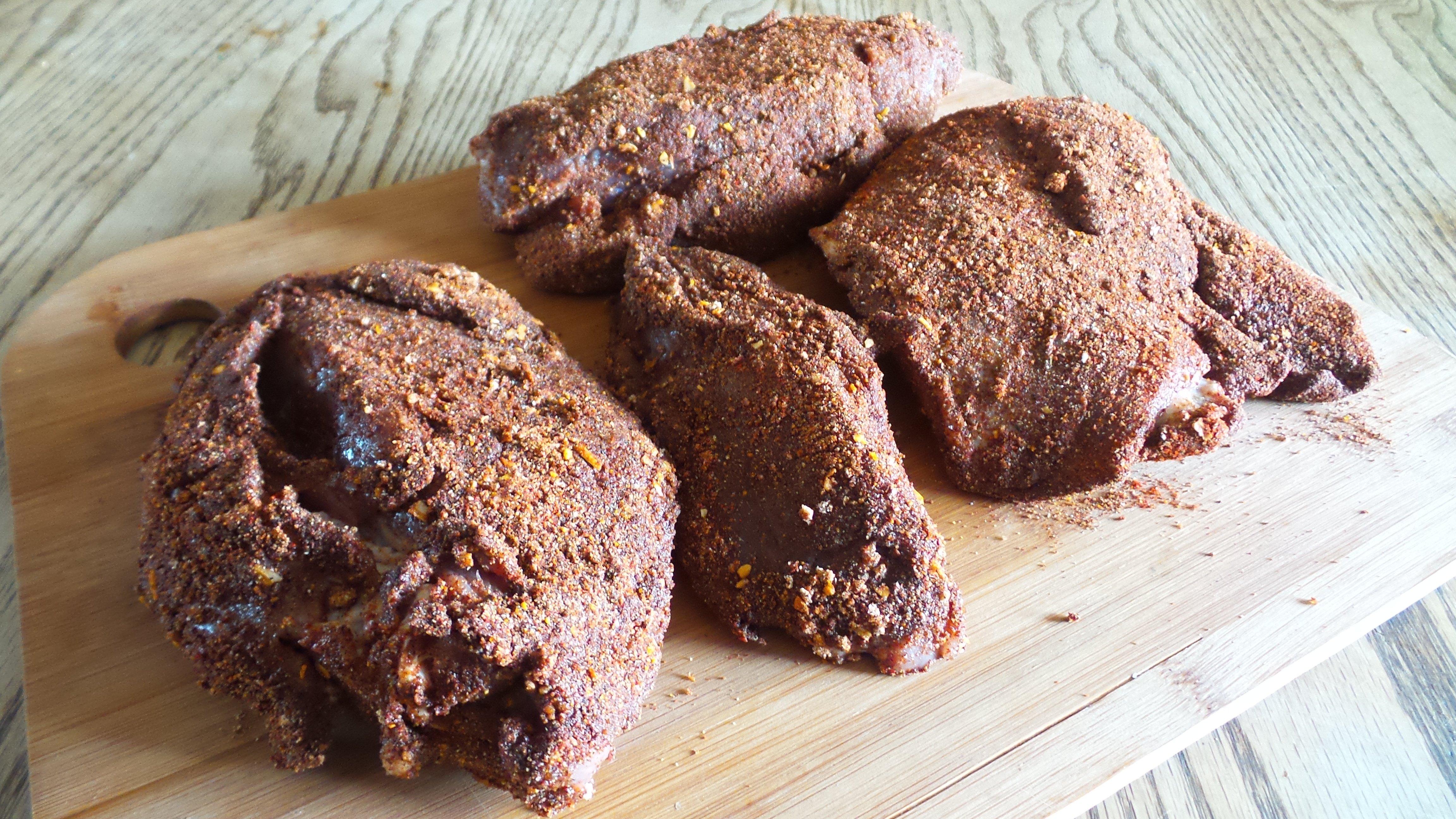 Apply a thick coating of the dry rub to the venison before smoking.