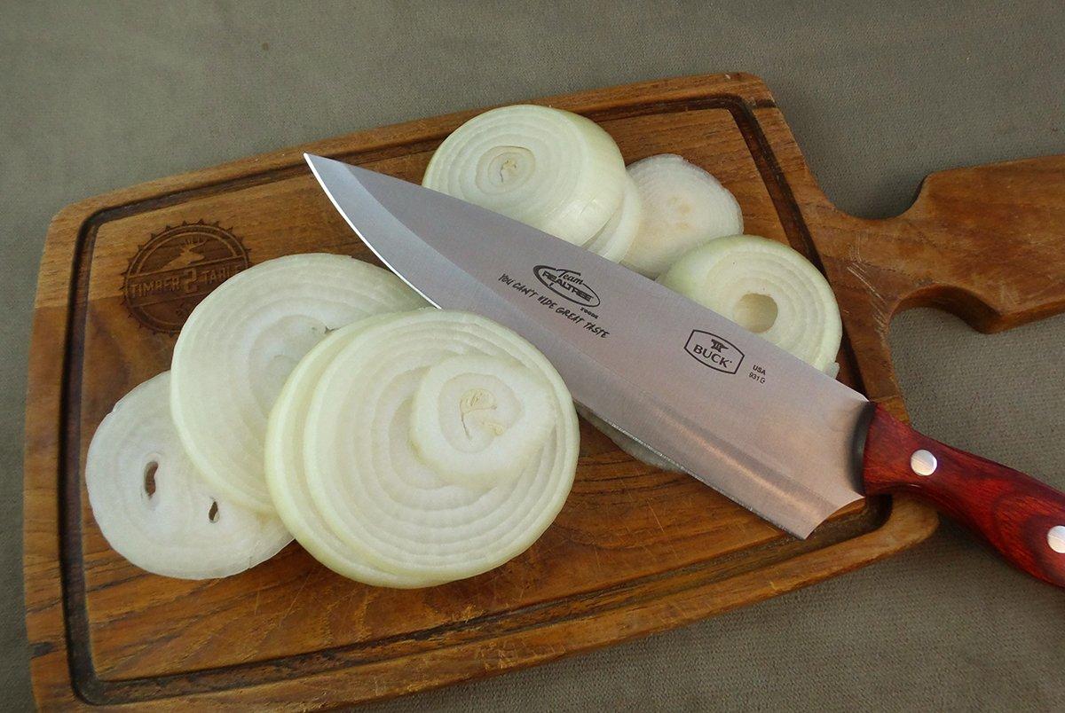 Once the steaks have browned, add the onions to the pan.