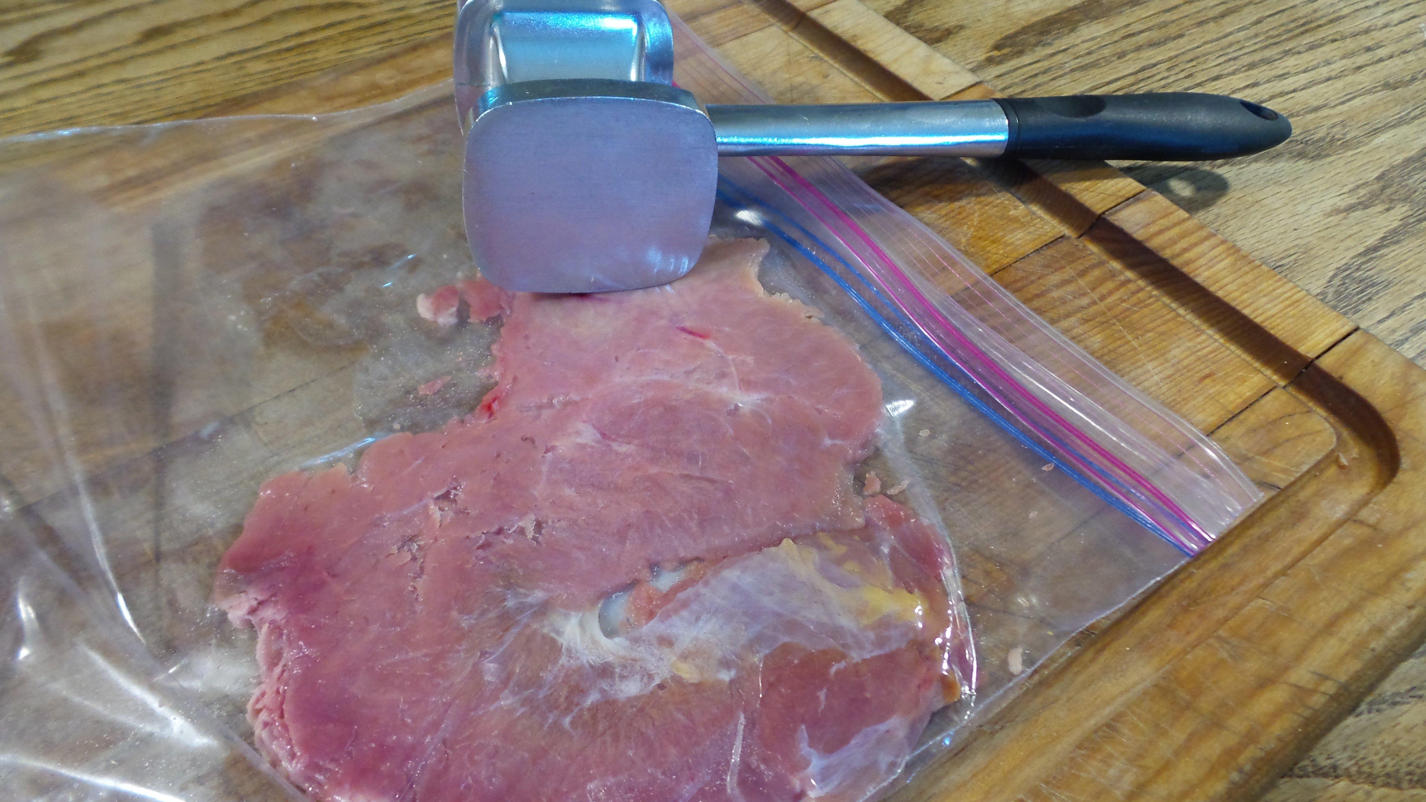 Pound each cutlet flat with a smooth meat mallet.
