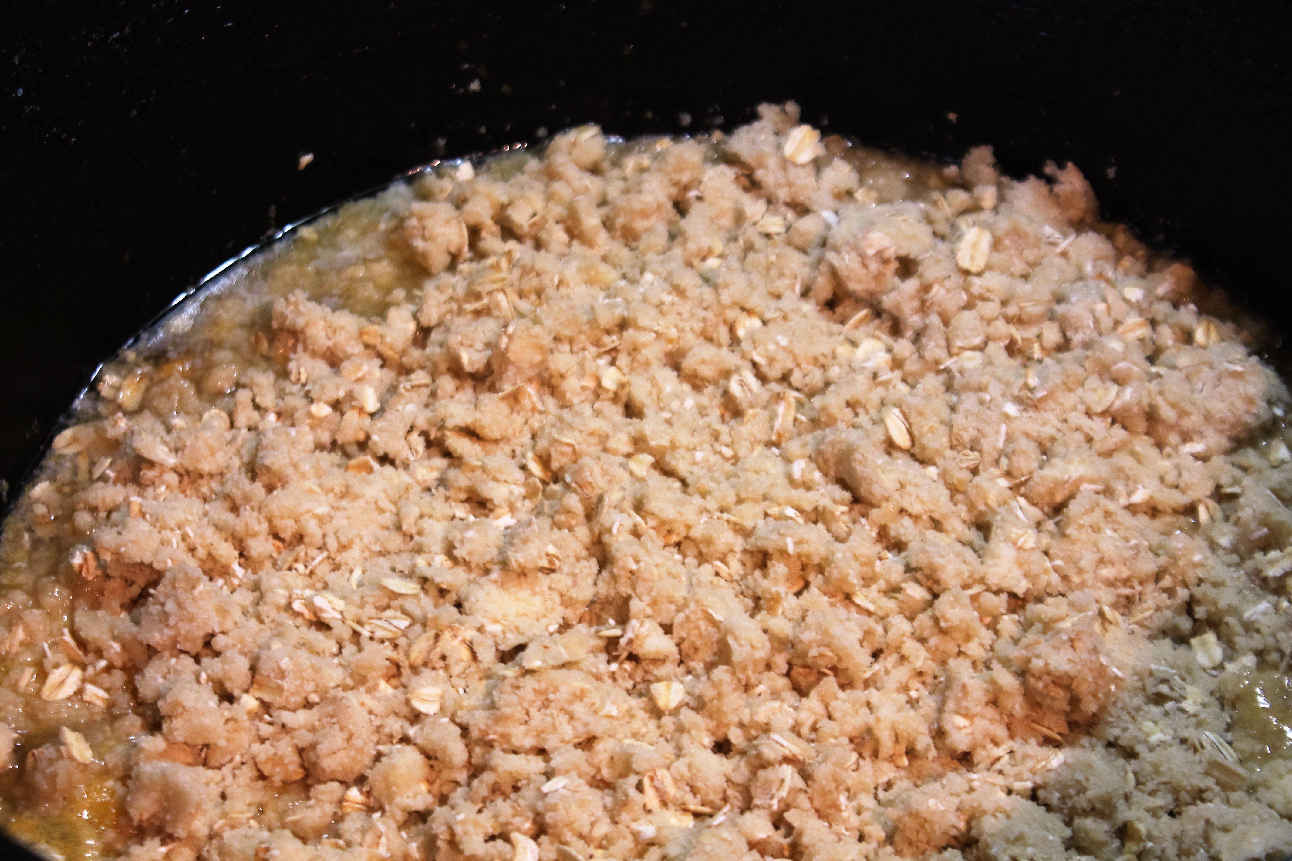 Pour filling into Dutch oven and sprinkle over topping mixture.