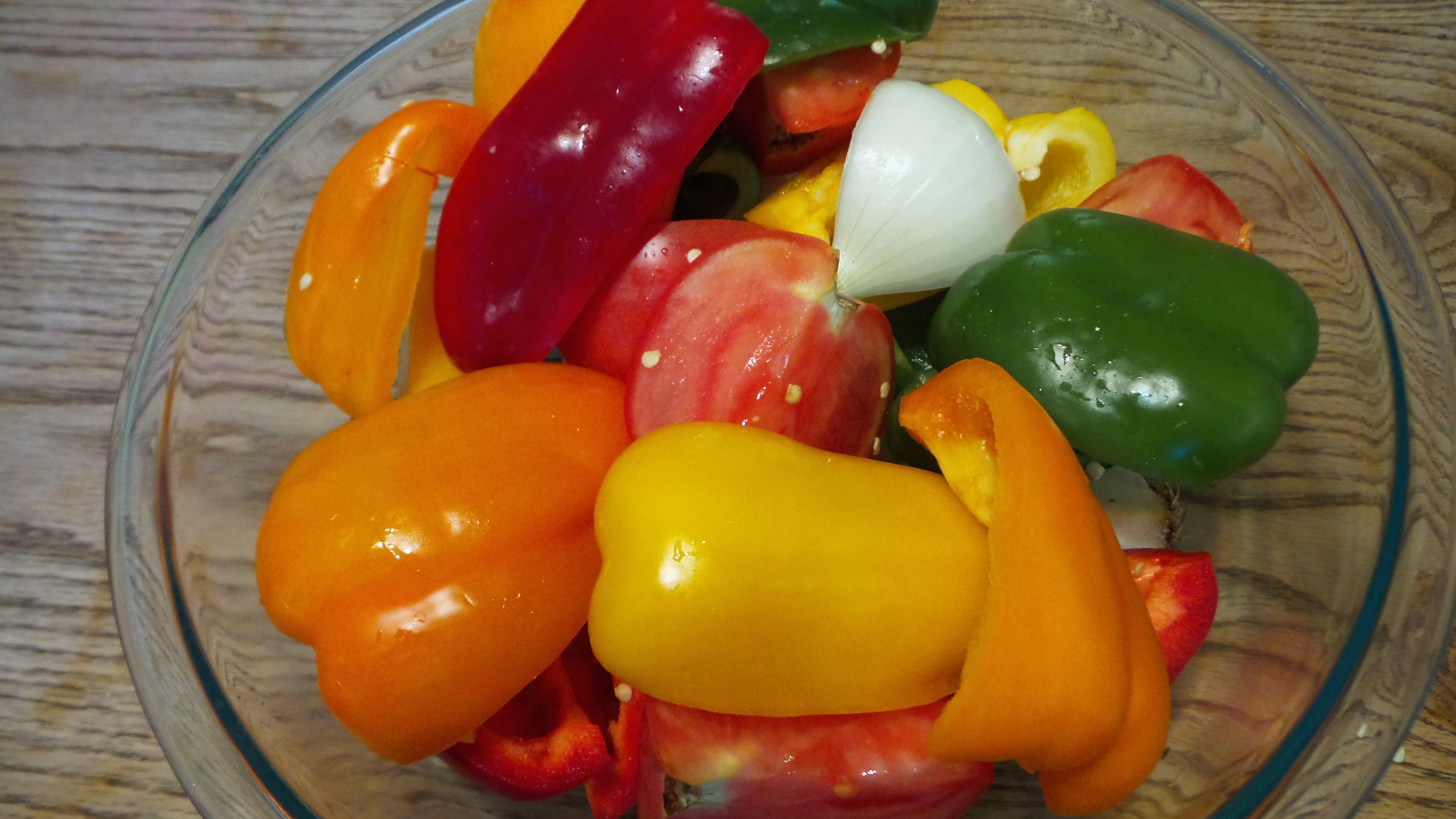 Quarter the vegetables and toss with olive oil before seasoning.