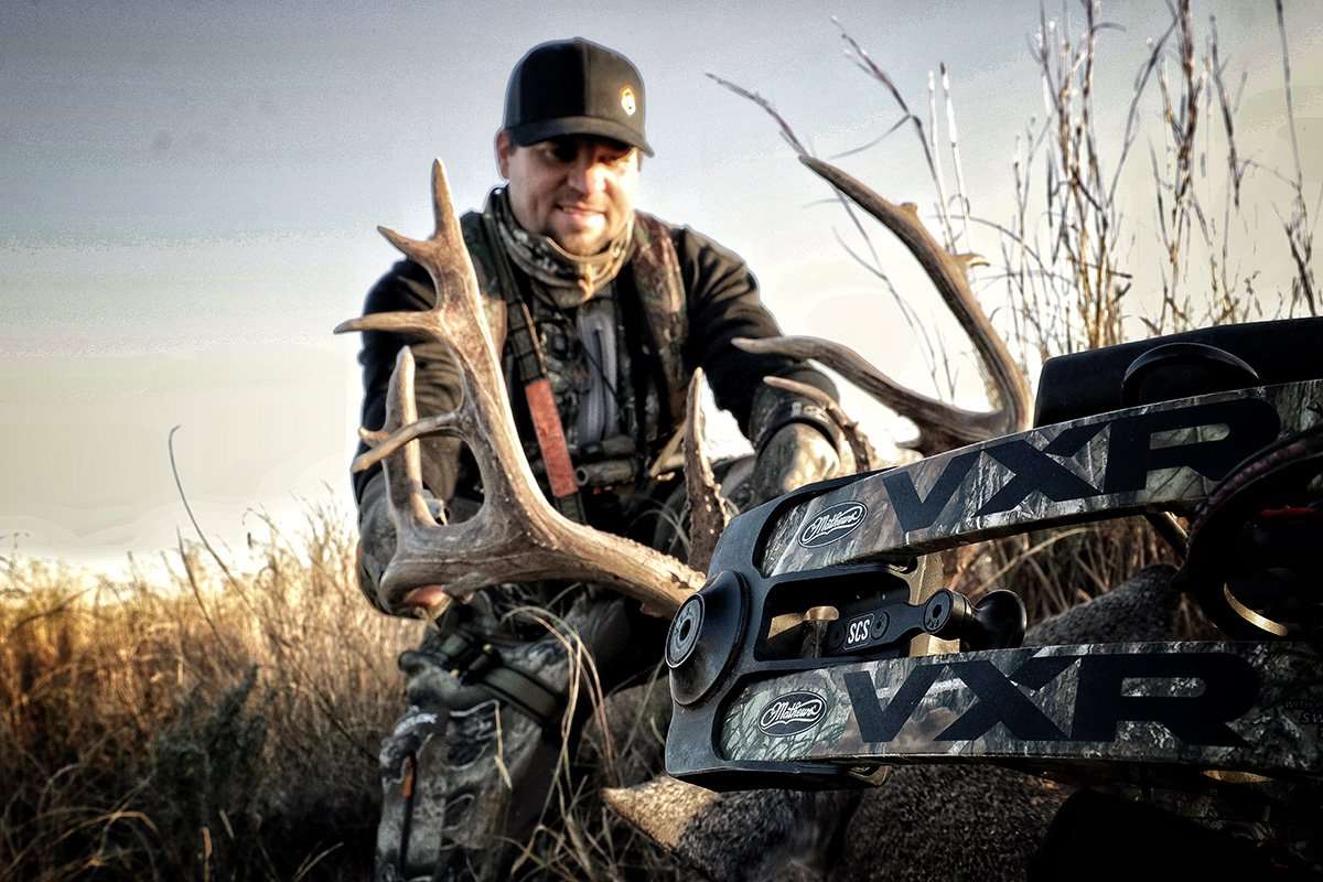 Randy Birdsong admires his biggest buck ever. (HeadHunters TV photo)