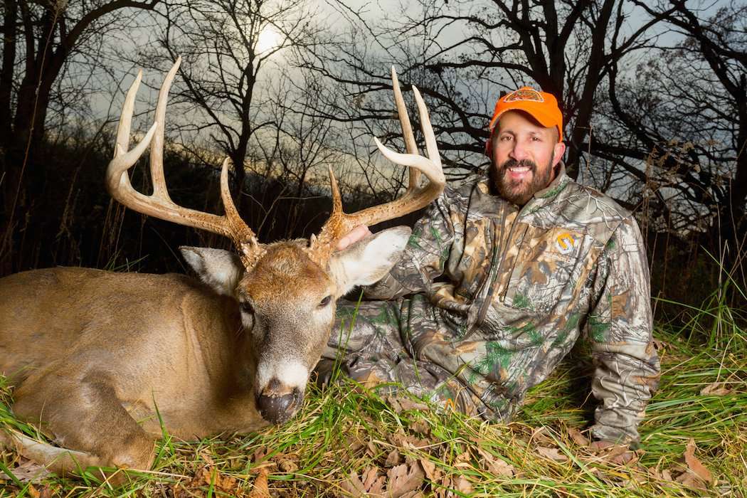 Dan with his giant buck. (Photo courtesy of Dan Perez)