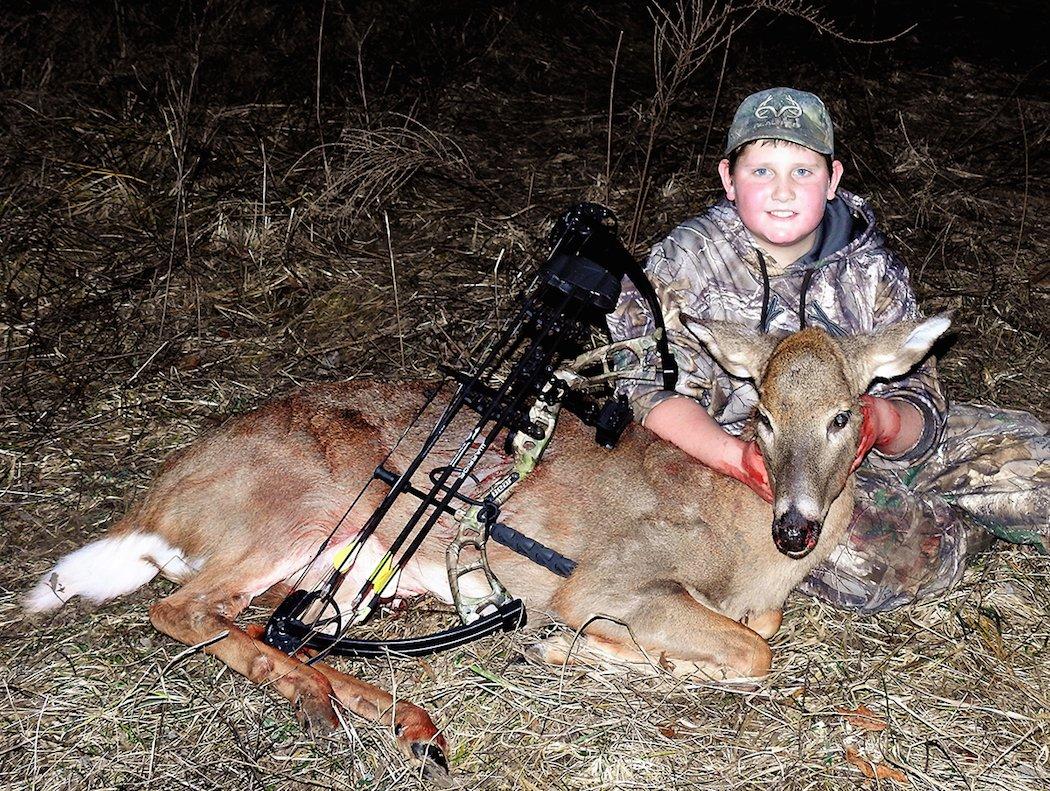 Michael's son, Potroast, poses with a nice, big doe he killed with his bow. (Michael Pendley photo)