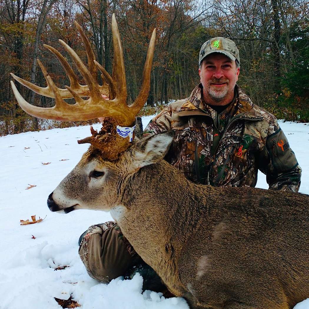 Odom proudly sits behind the buck of a lifetime. (Photo courtesy of Dan Odom)