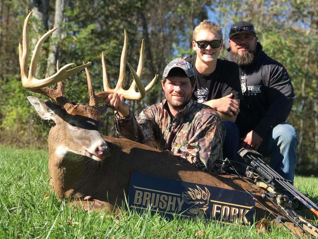 Hiram Cutter, guide Fin Badgewick and outfitter Bryan Dawes are all smiles behind Cutter's buck of a lifetime. (Hiram Cutter photo)