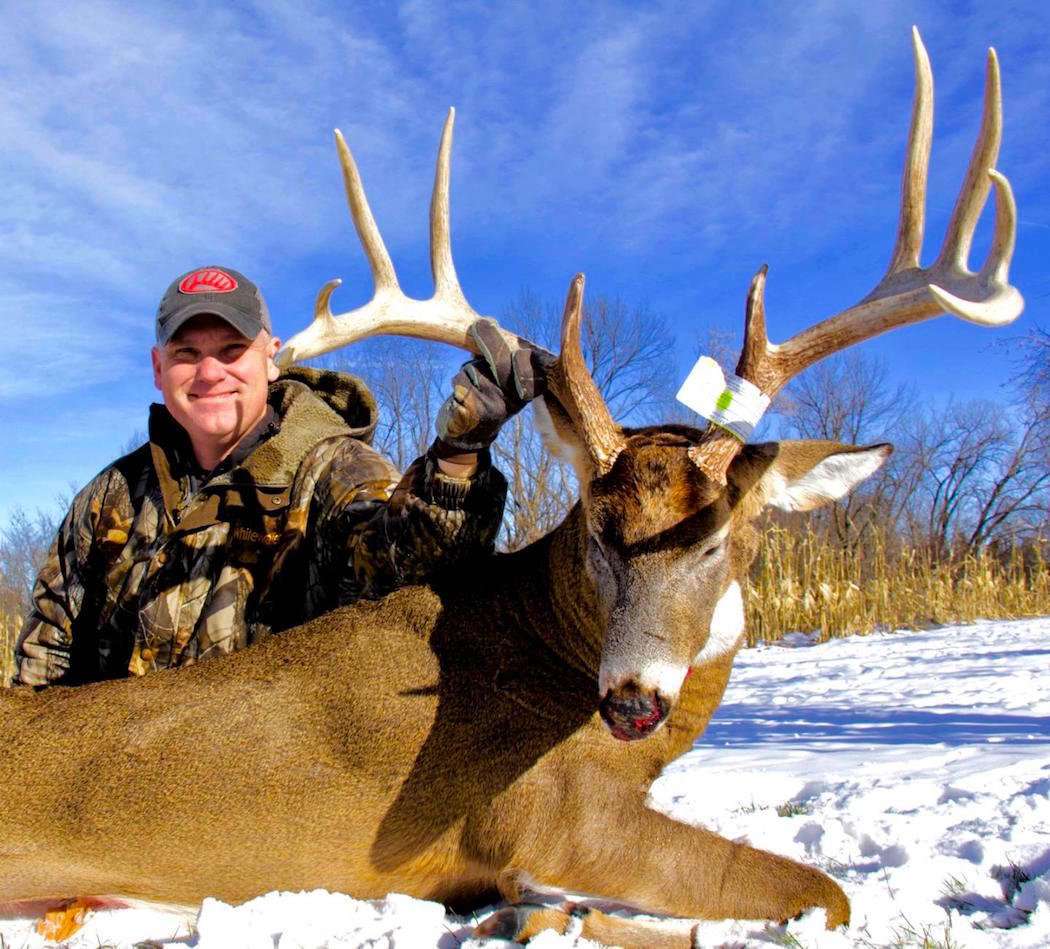 Grant Olson shows off his big late-season Iowa buck. (Grant Olson photo)