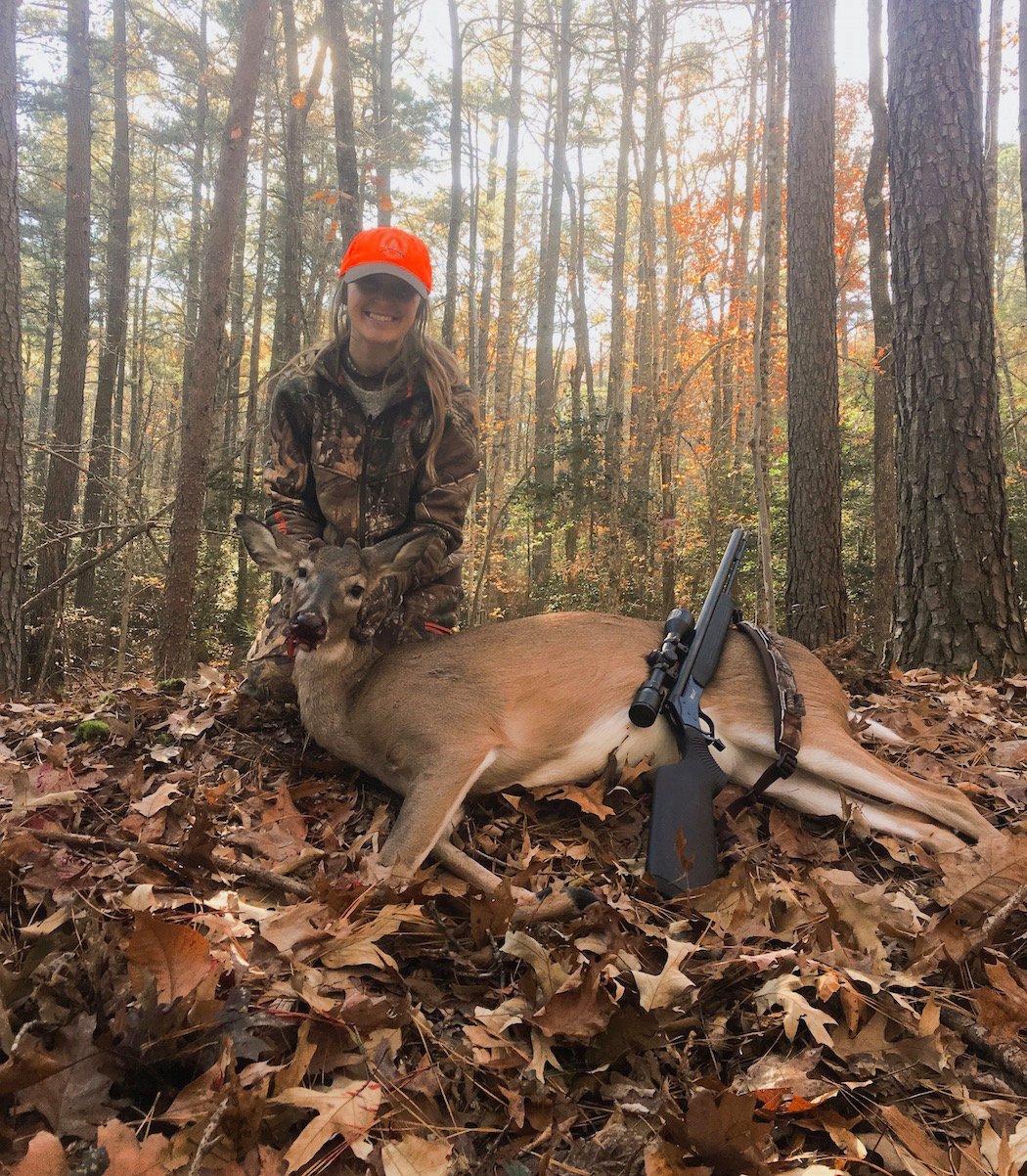 The author poses with her first deer. (Emily George photo)