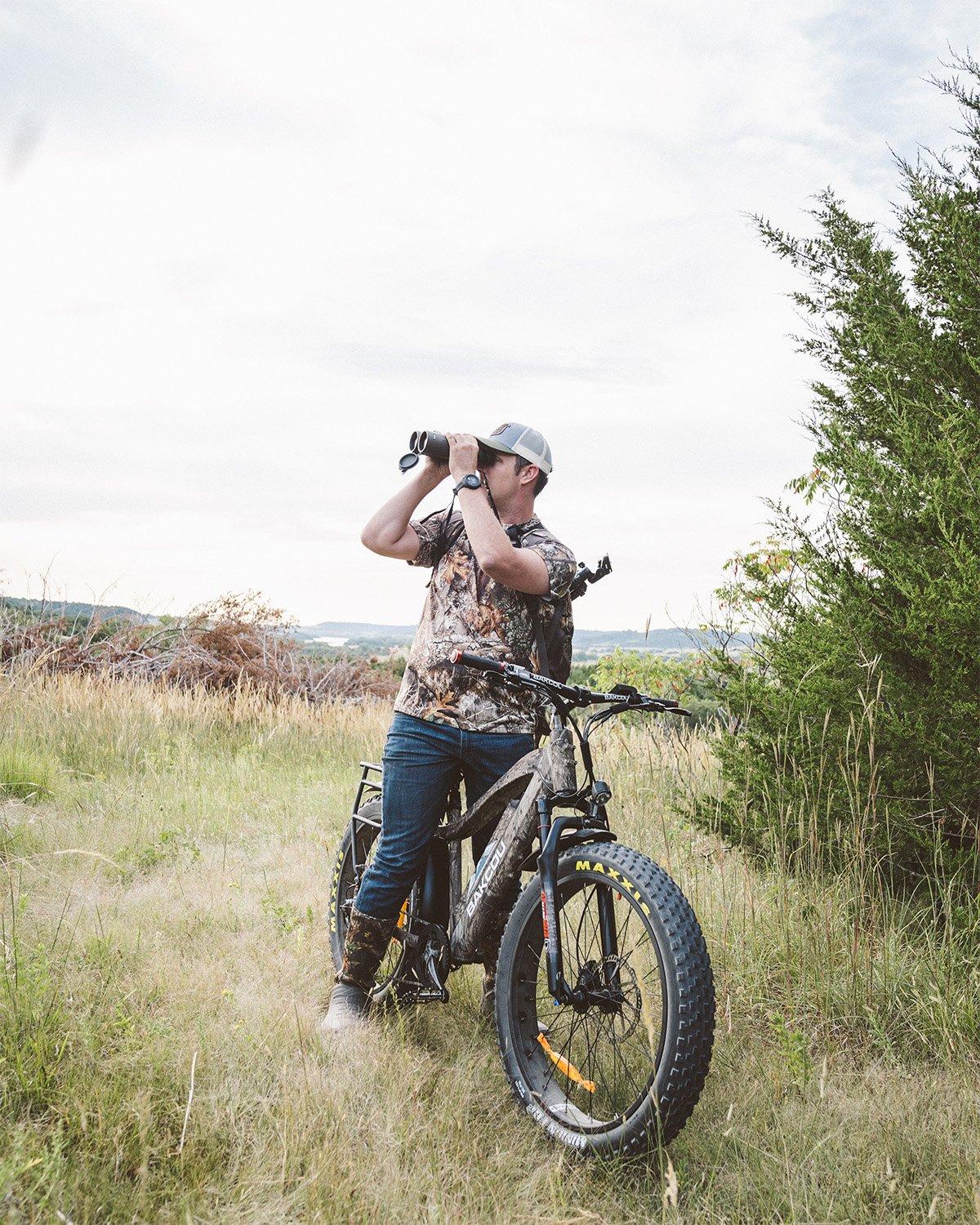 Realtree's Tyler Jordan field-tests one of Bakcou's nifty e-bikes. A headlight and mud fenders trick them out, and you can bungee cord a wild turkey to the rear pannier rack. Image by Realtree 365