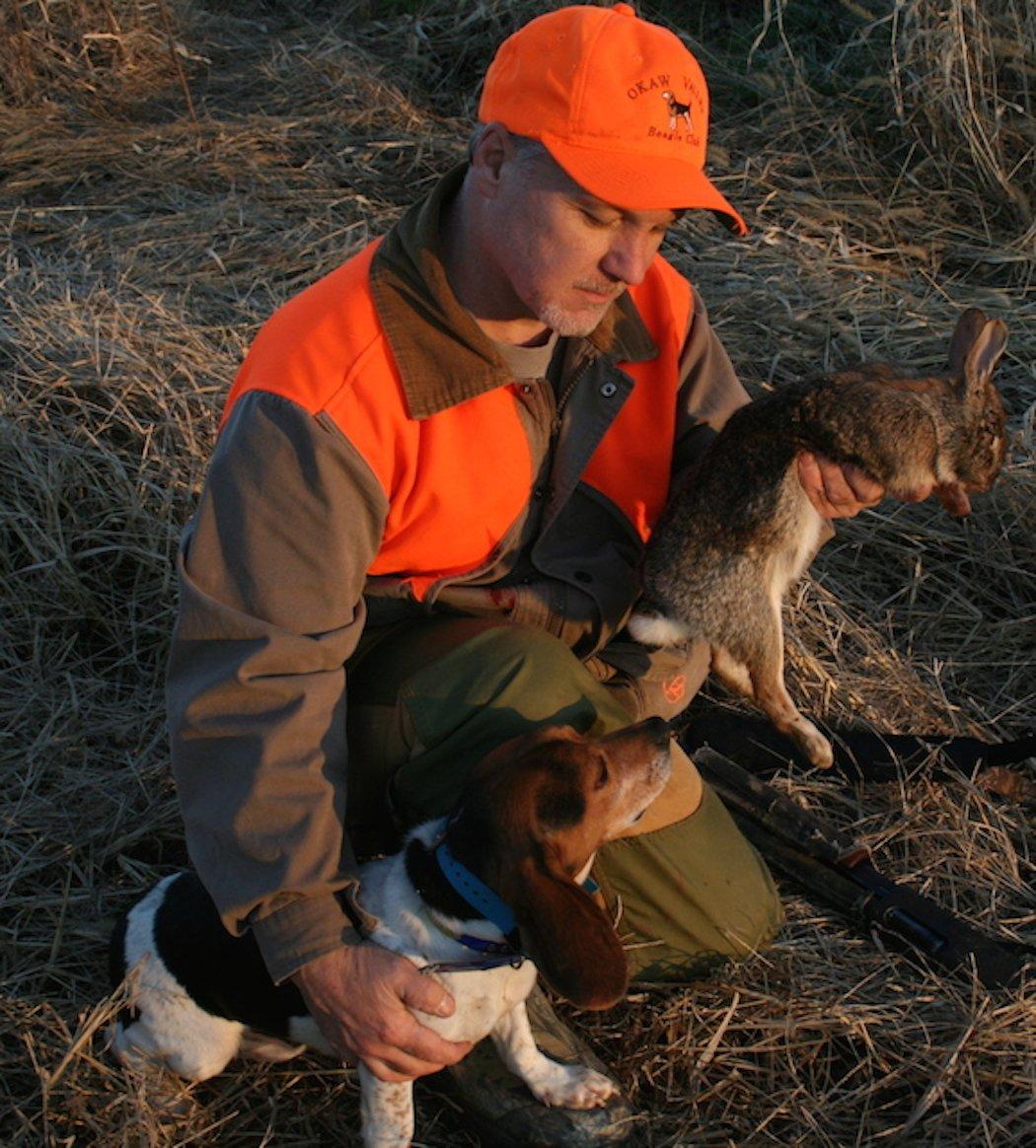 The author with one of his rabbit dogs. (Photo courtesy of Paul Moore)