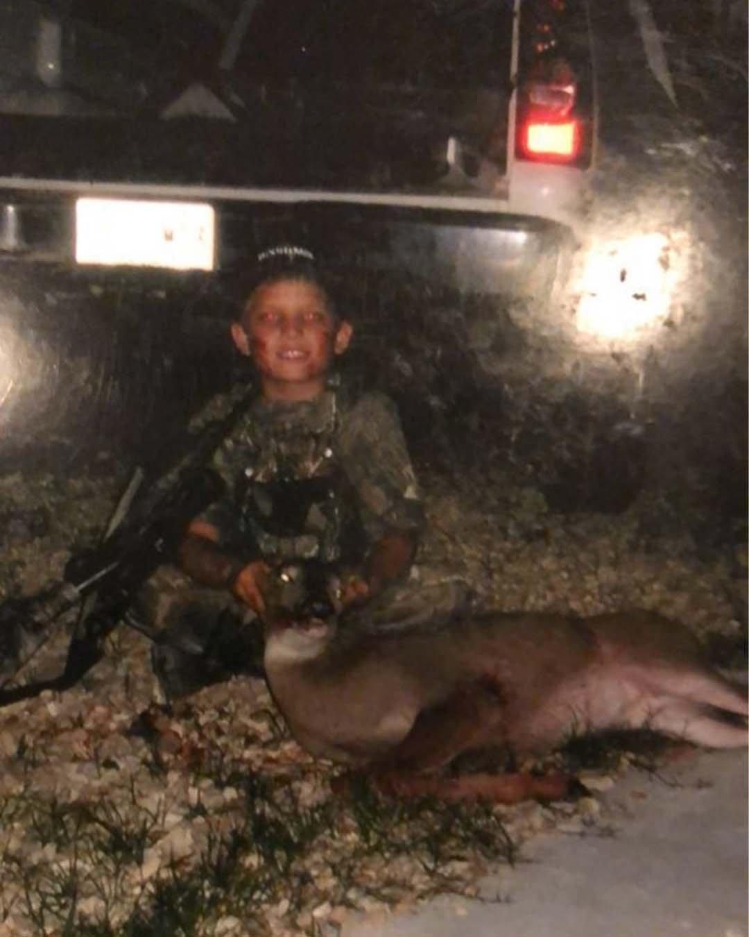 Austin Riley with his first whitetail, taken when he was 8 or 9 years old.