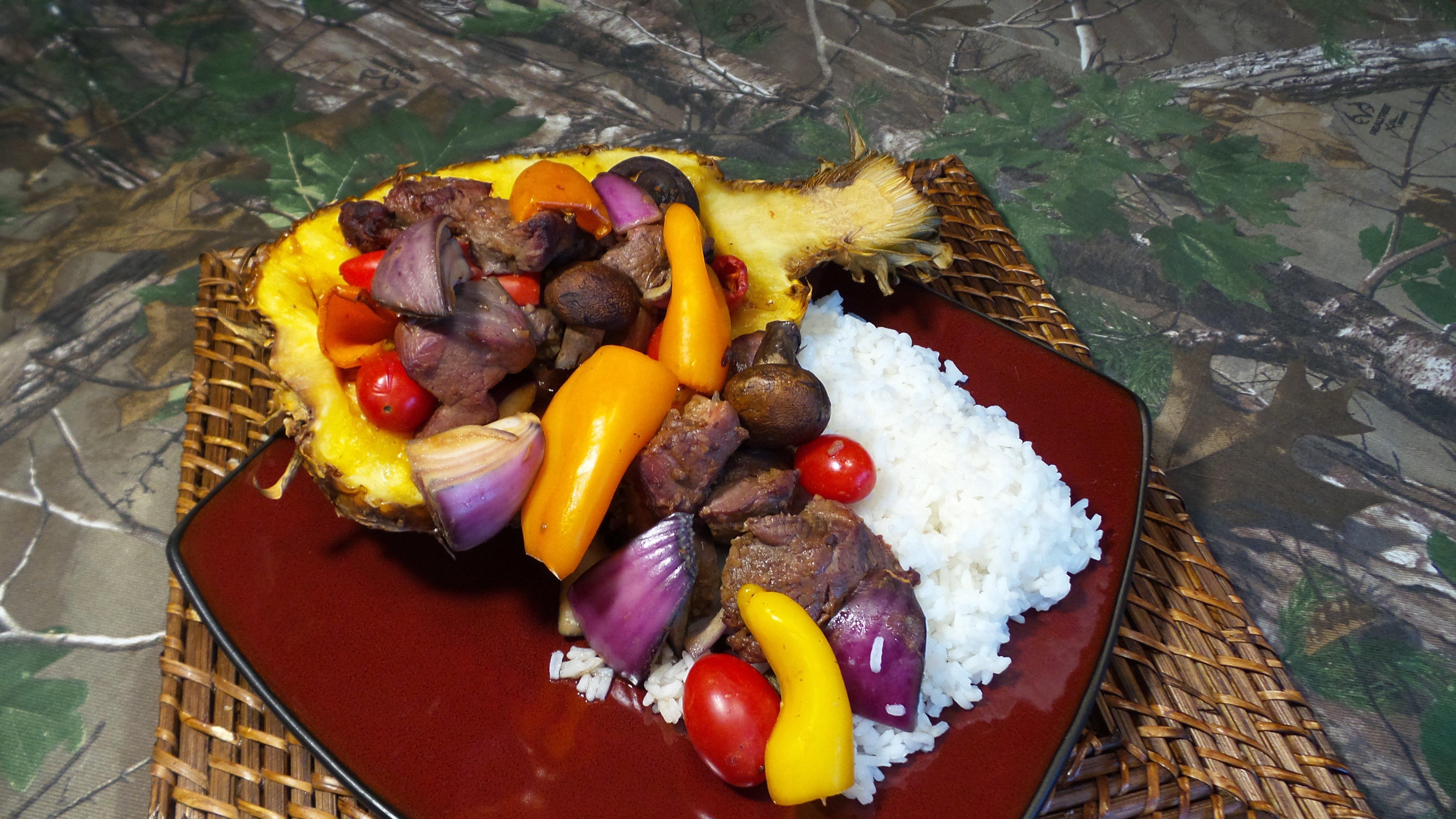 Serve the pineapple halves over white rice.