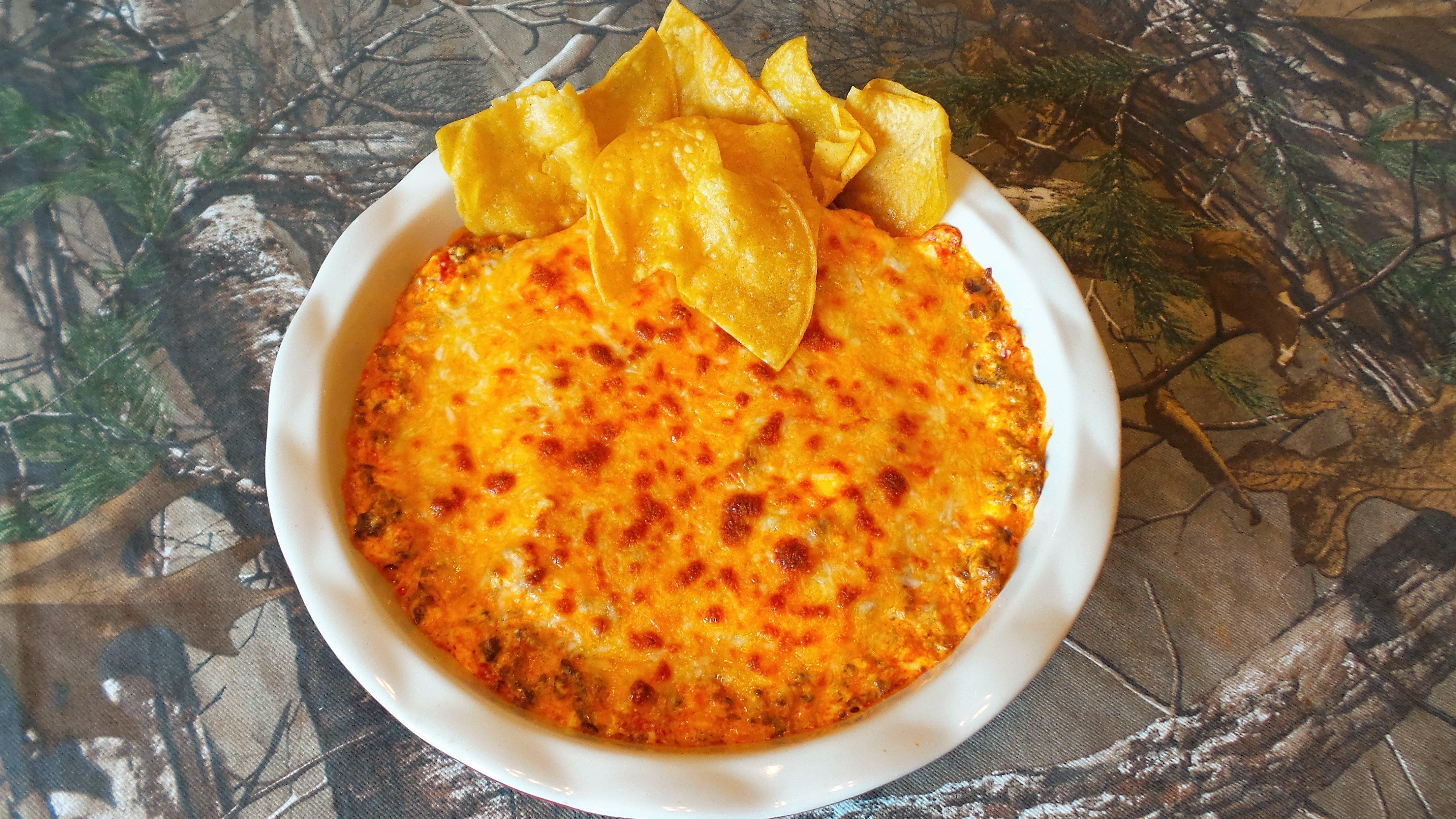 Serve the dip piping hot with corn chips for dipping.