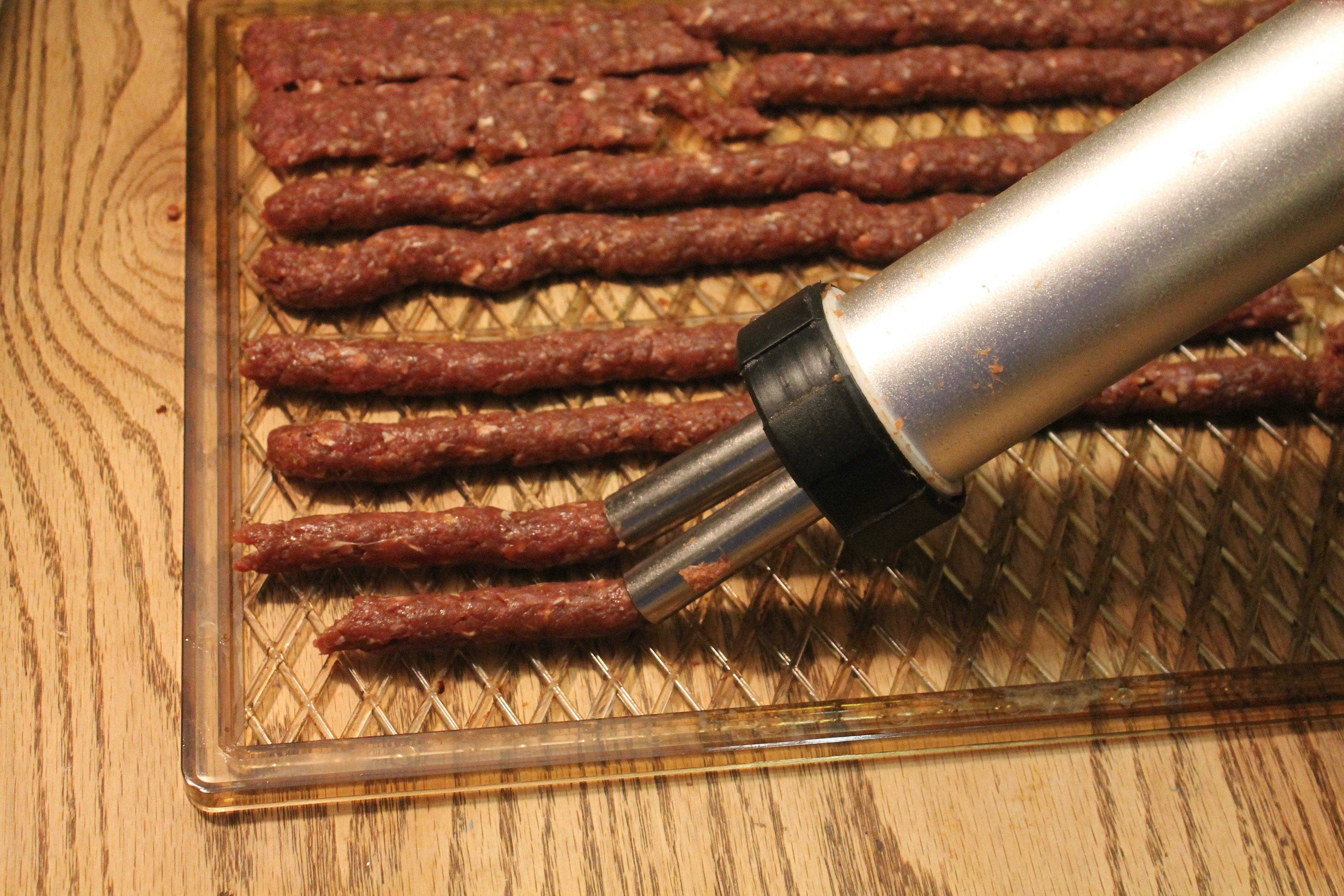 Meat sticks through the Weston Jerky gun.